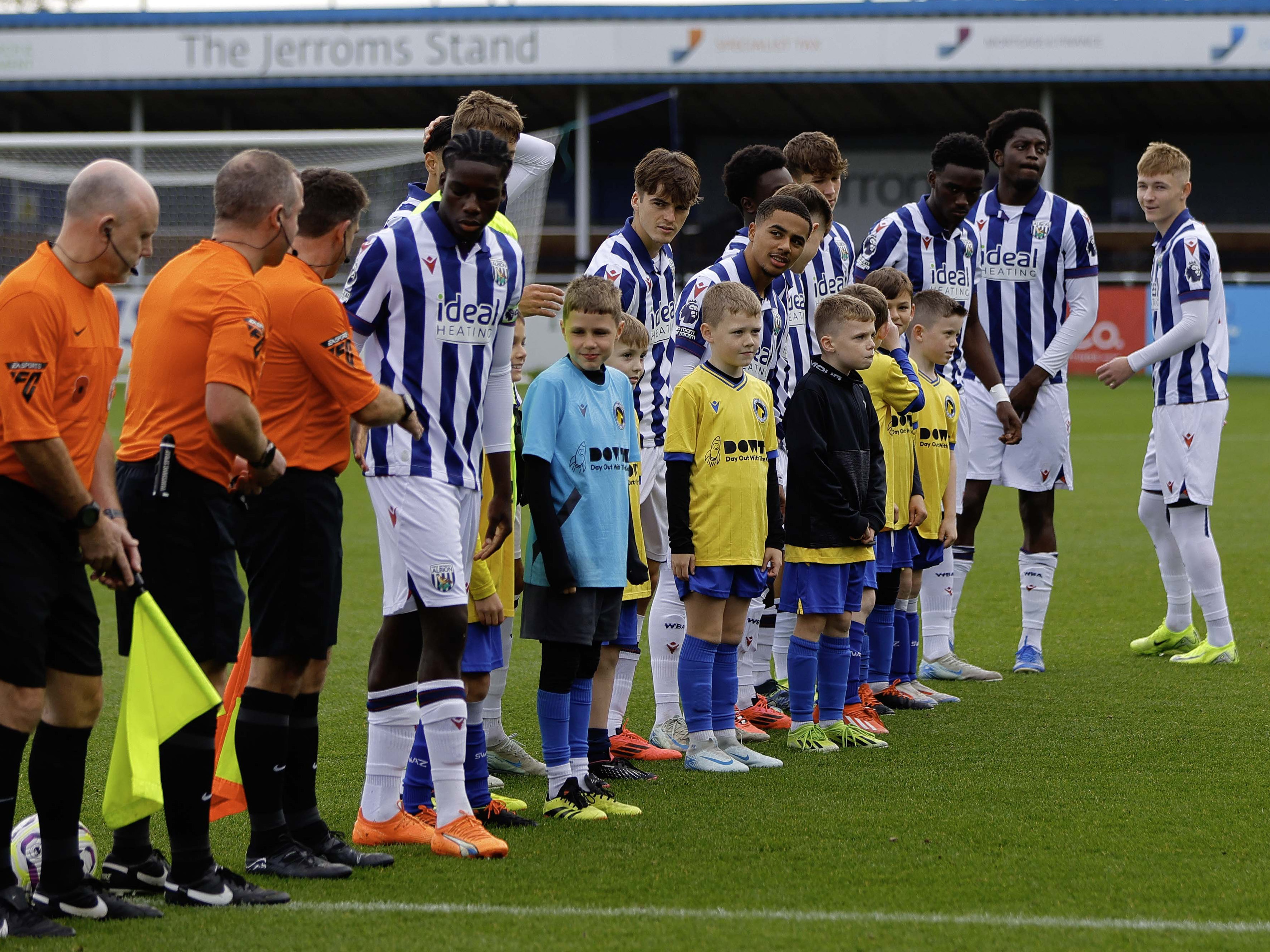 A photo of Albion u21s, in the 2024/25 home kit, lining up before a PL2 match