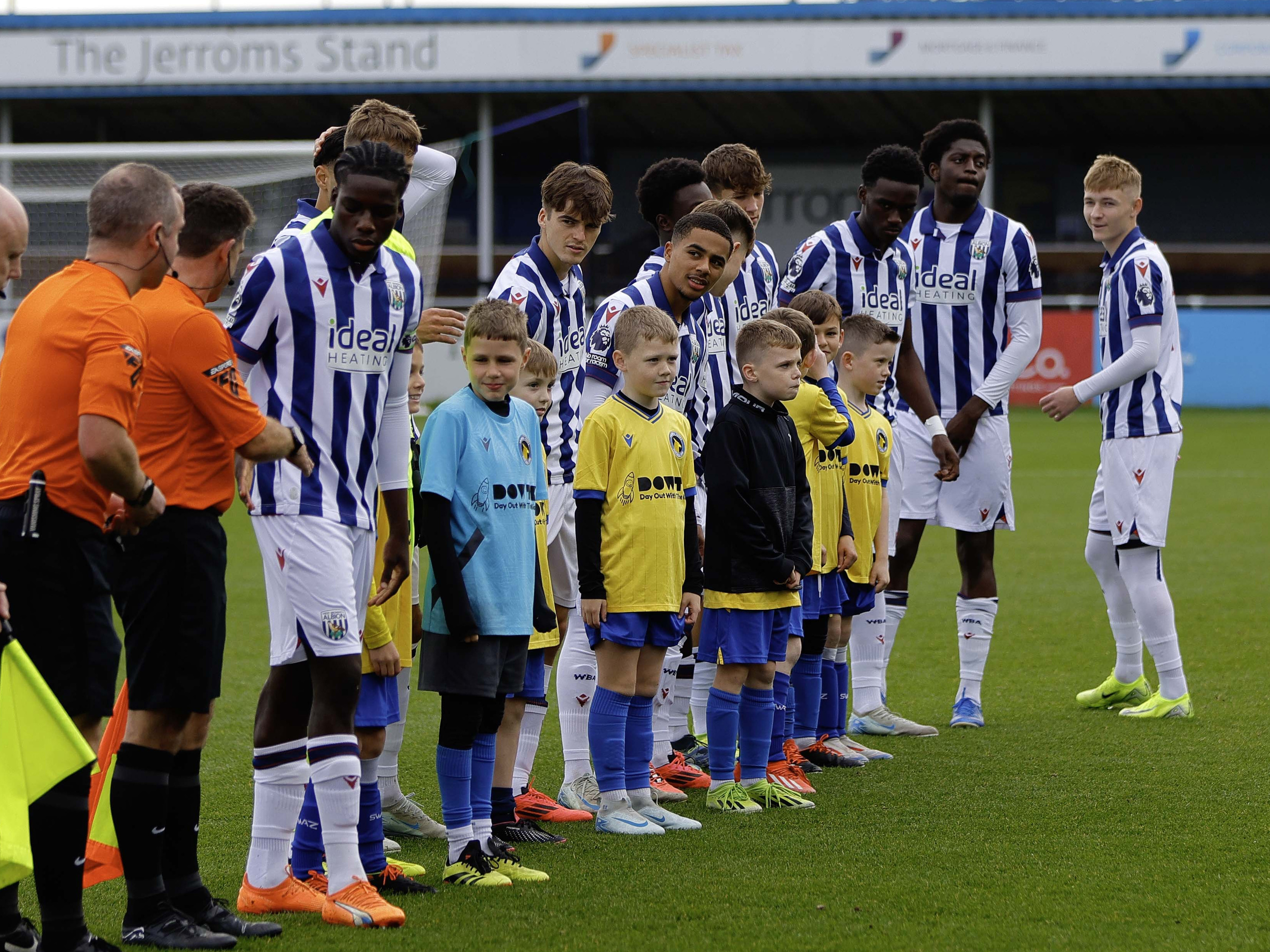 A general view of Albion's PL2 team lining up before a game wearing the home kit 