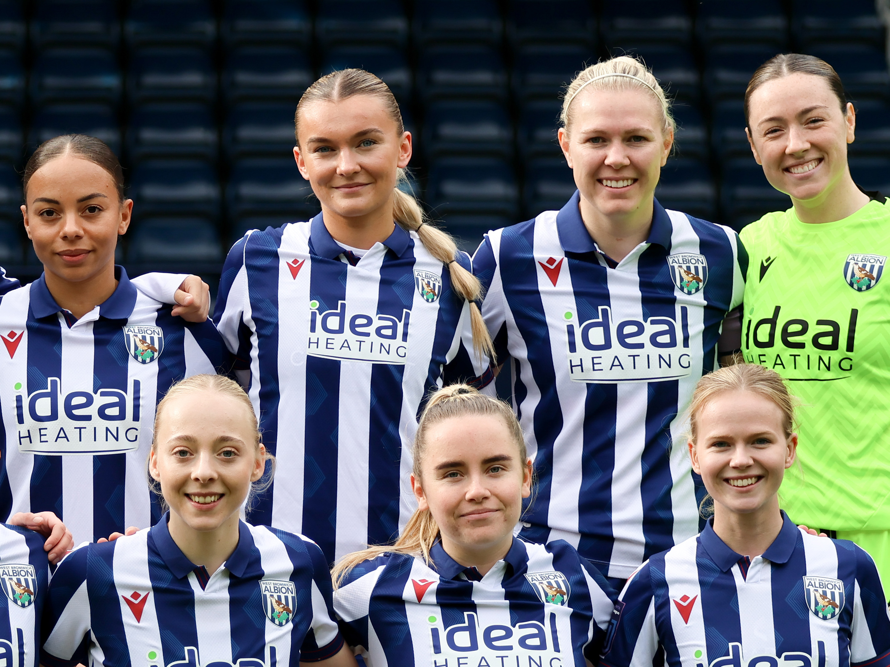 Taylor Reynolds in the middle of a team line up before a game at The Hawthorns with the players wearing the home kit 