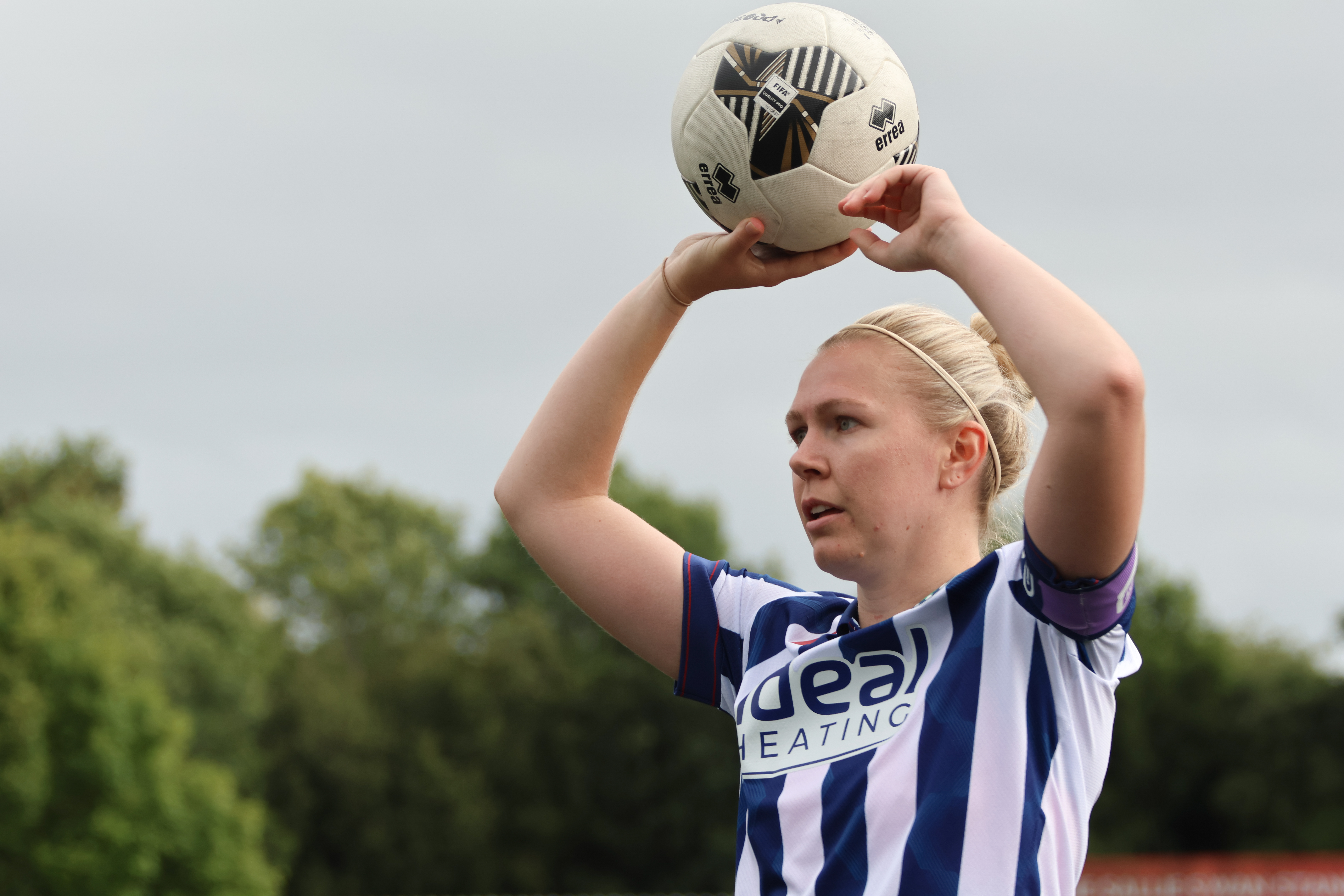 Hannah George takes a throw-in.