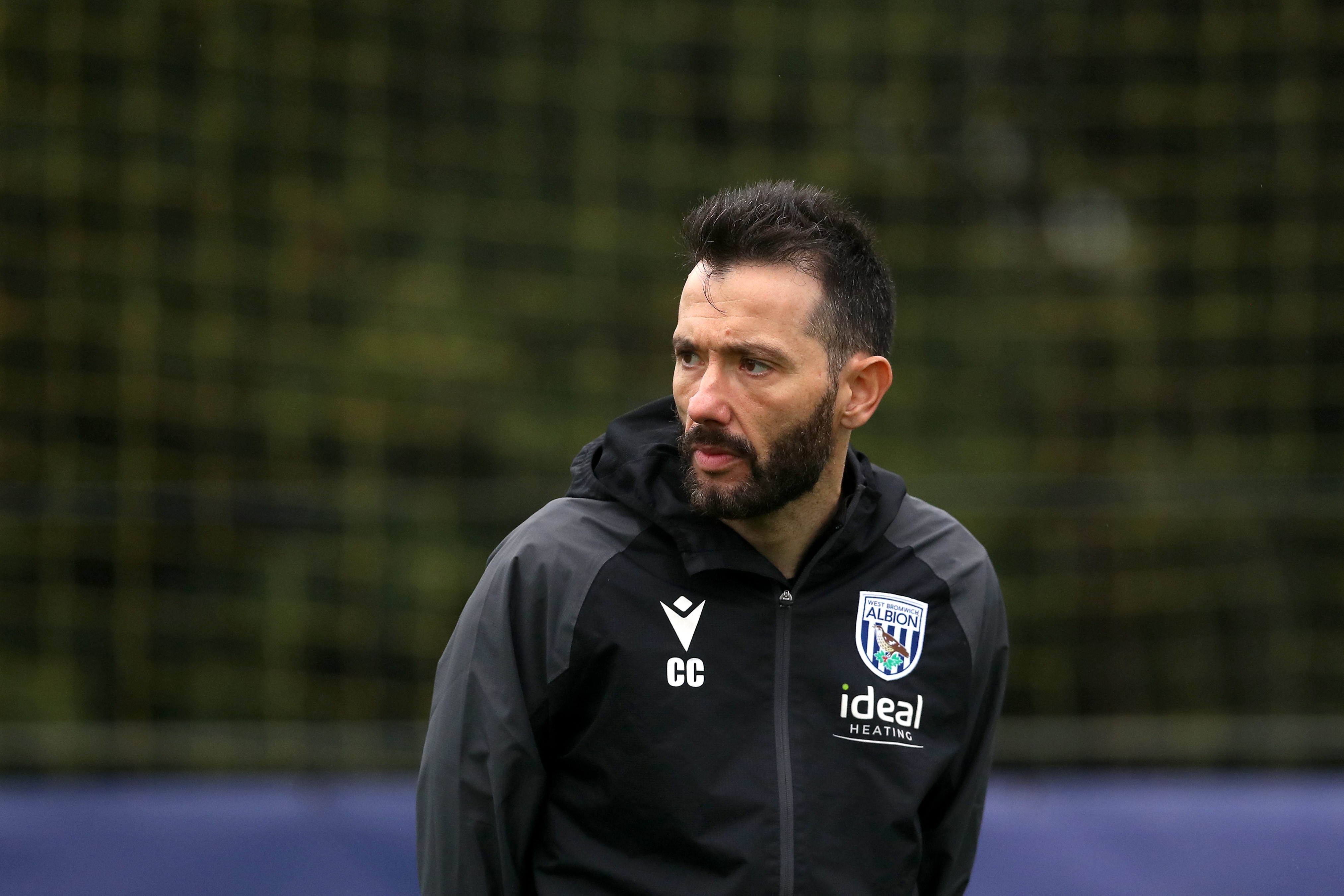 Carlos Corberán watching training 