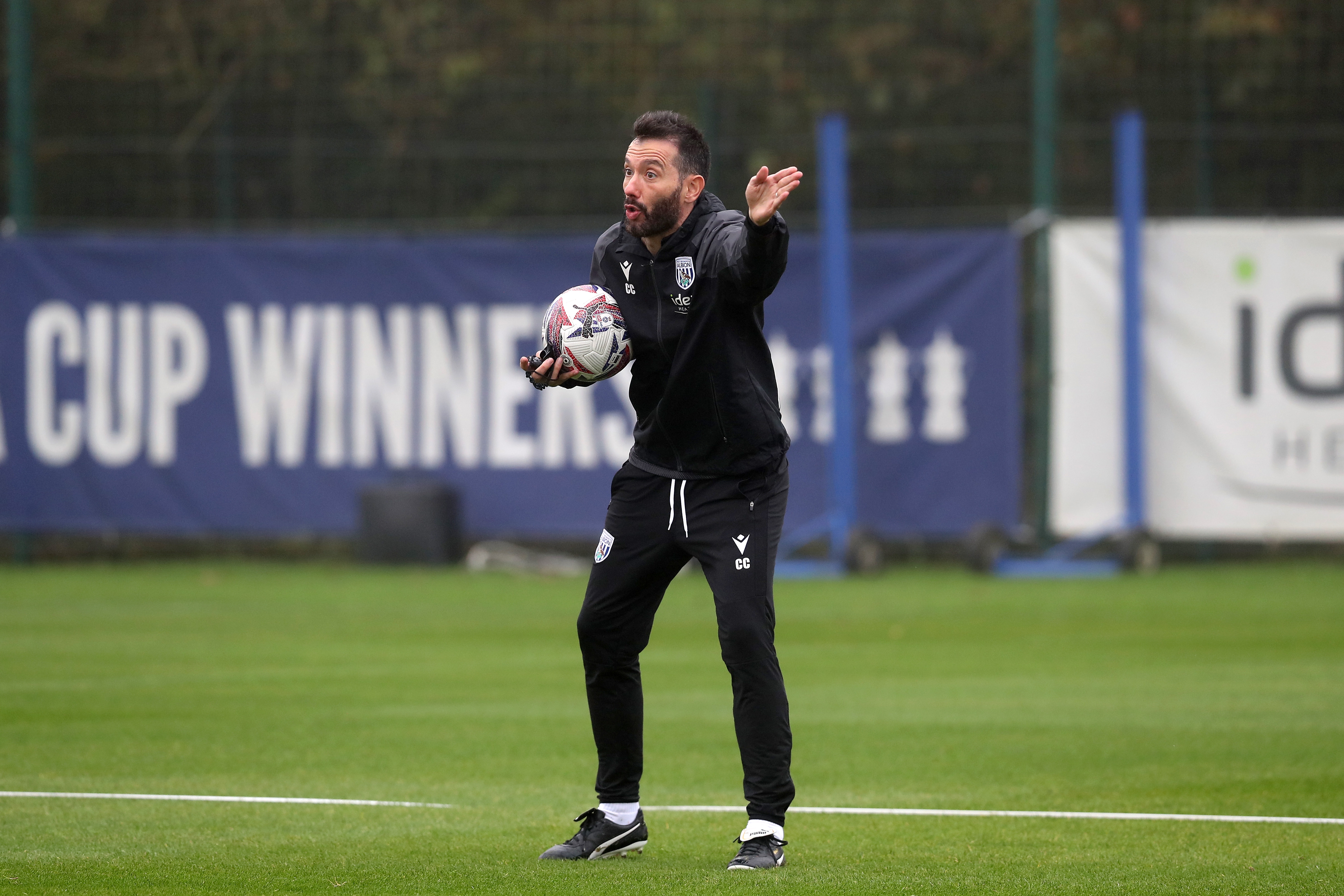 Carlos Corberán delivering instructions to his players during a training session 