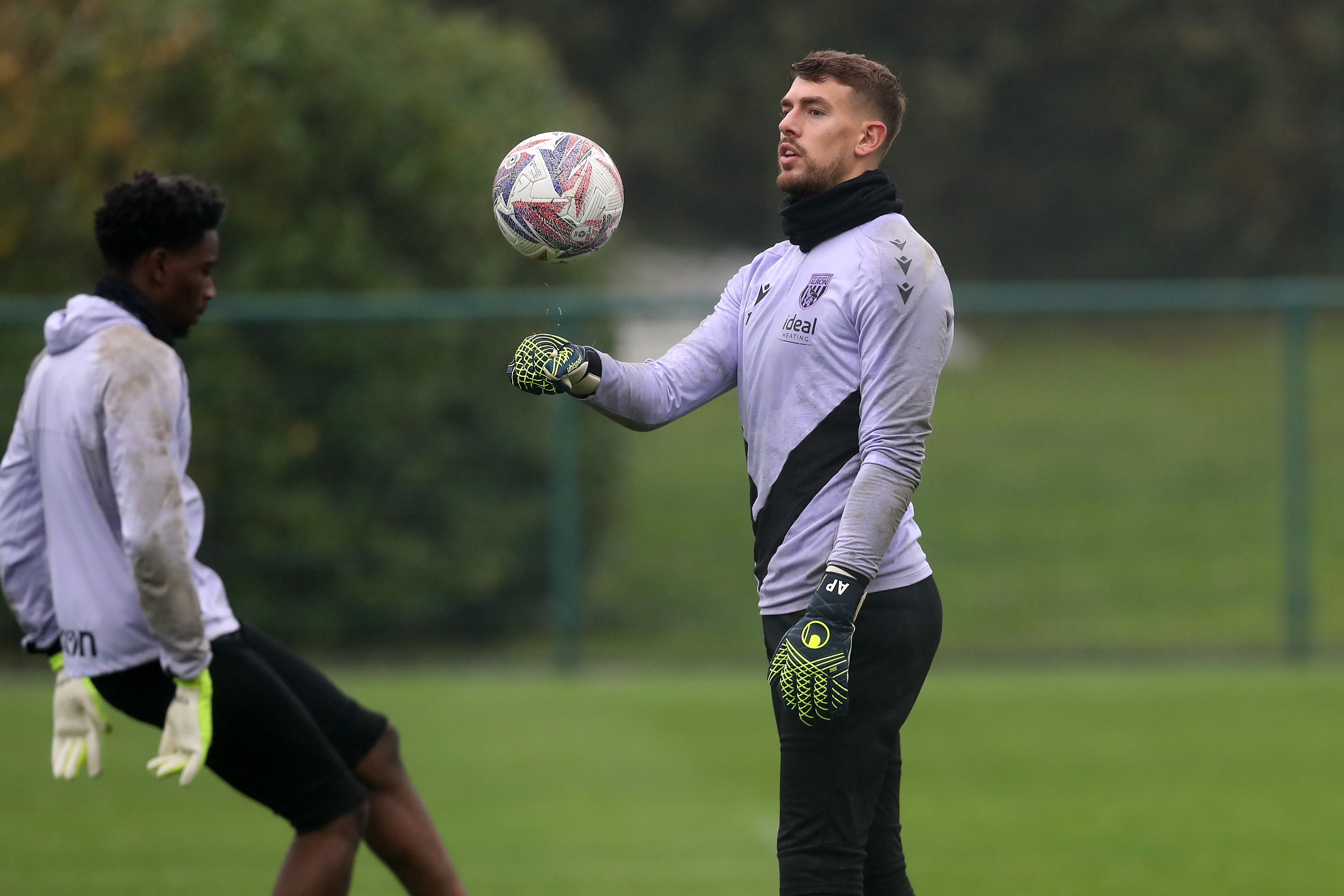 Alex Palmer juggling a ball during a training session