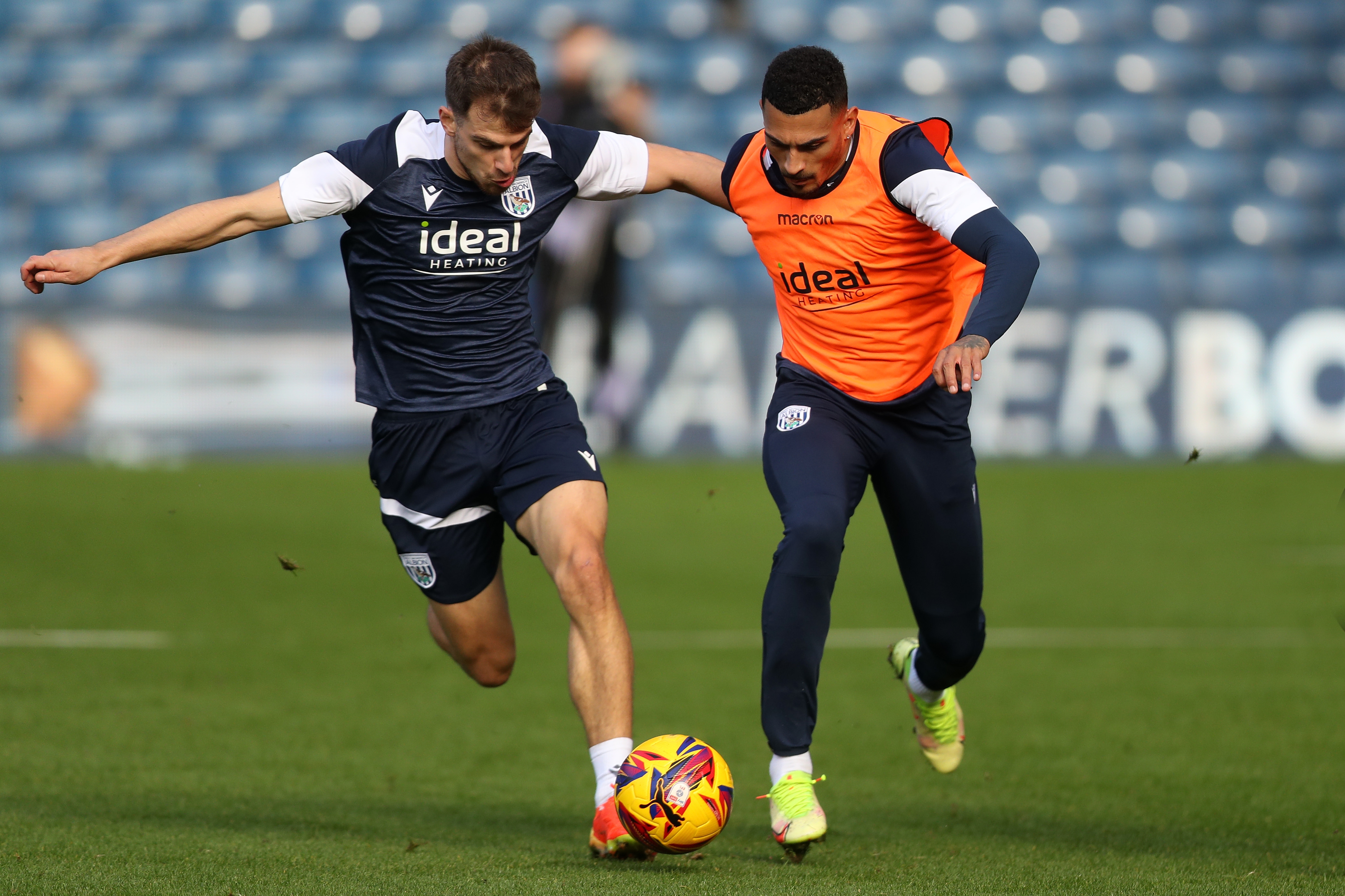 Jayson Molumby and Karlan Grant battle for the ball during a training session at The Hawthorns