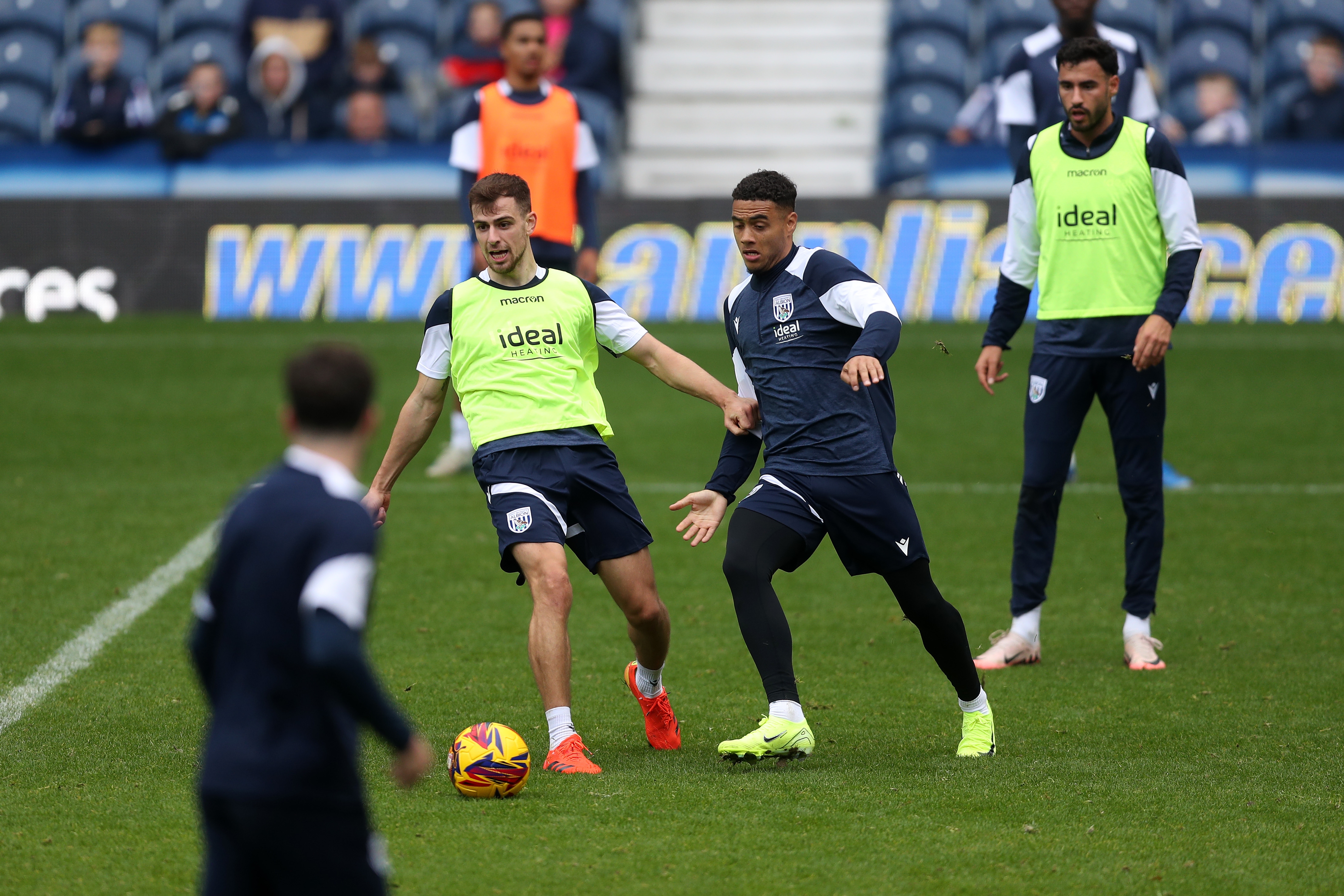 Jayson Molumby and Lewis Dobbin fight for the ball during a training session at The Hawthorns