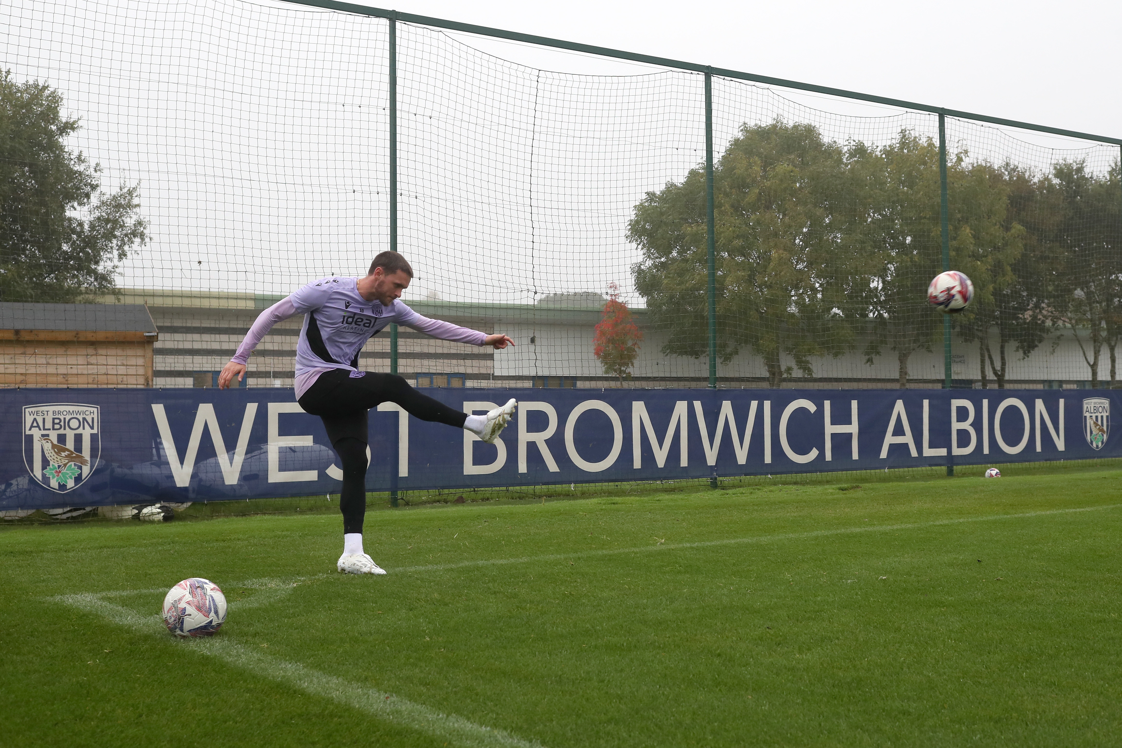 John Swift taking a corner during a training session 