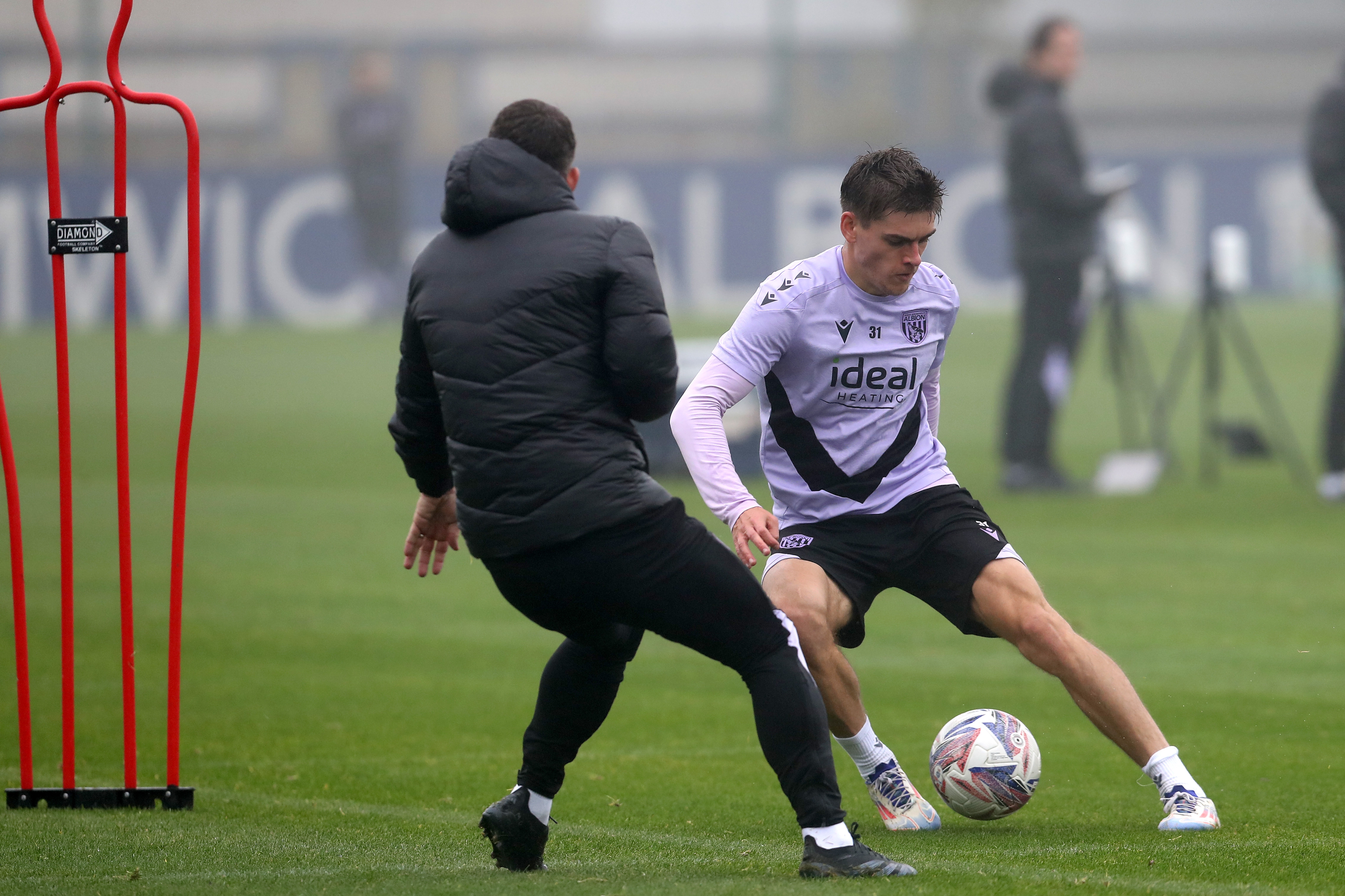 Tom Fellows dribbling with the ball during a training session 