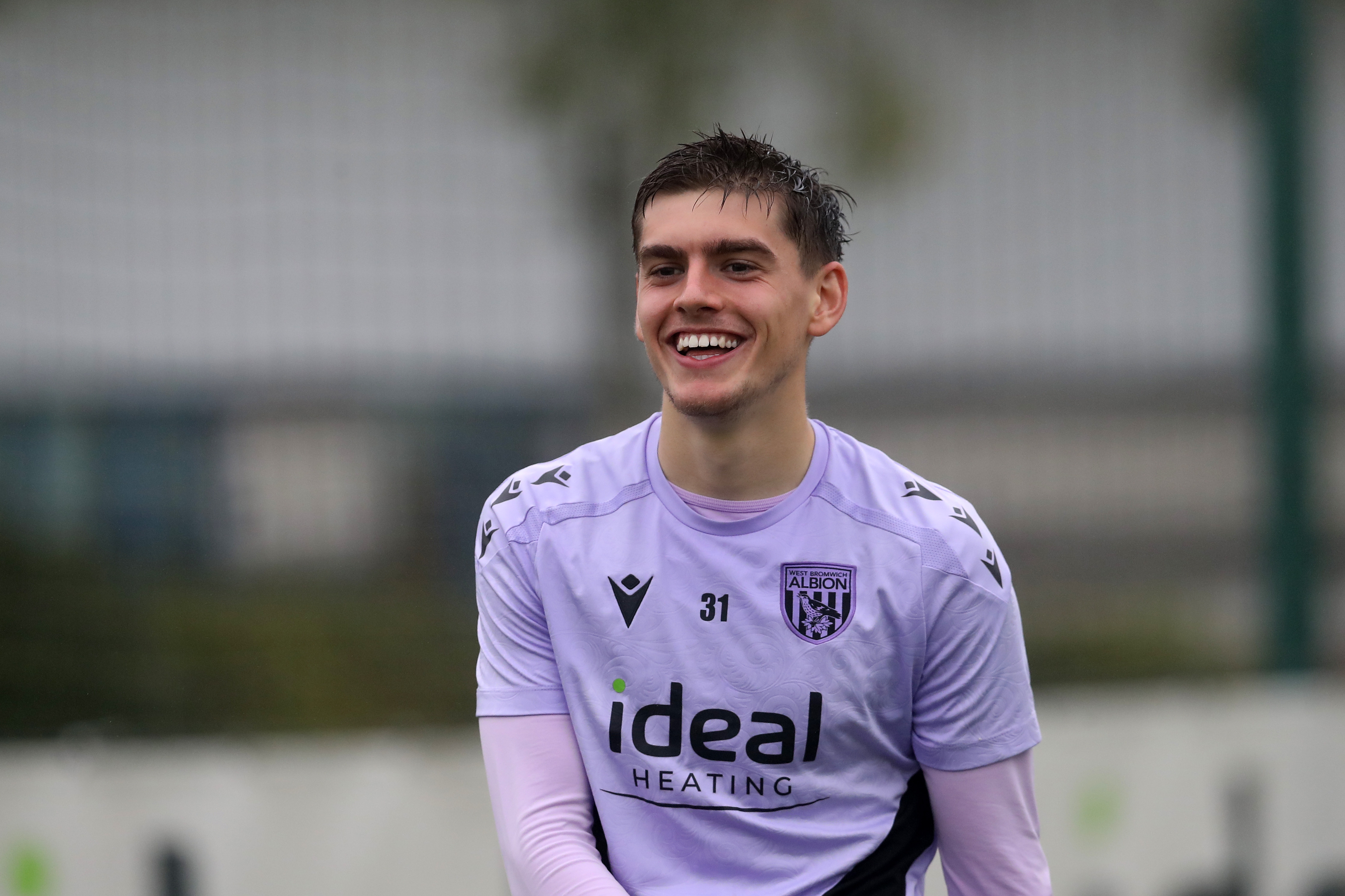 Tom Fellows smiling during a training session 