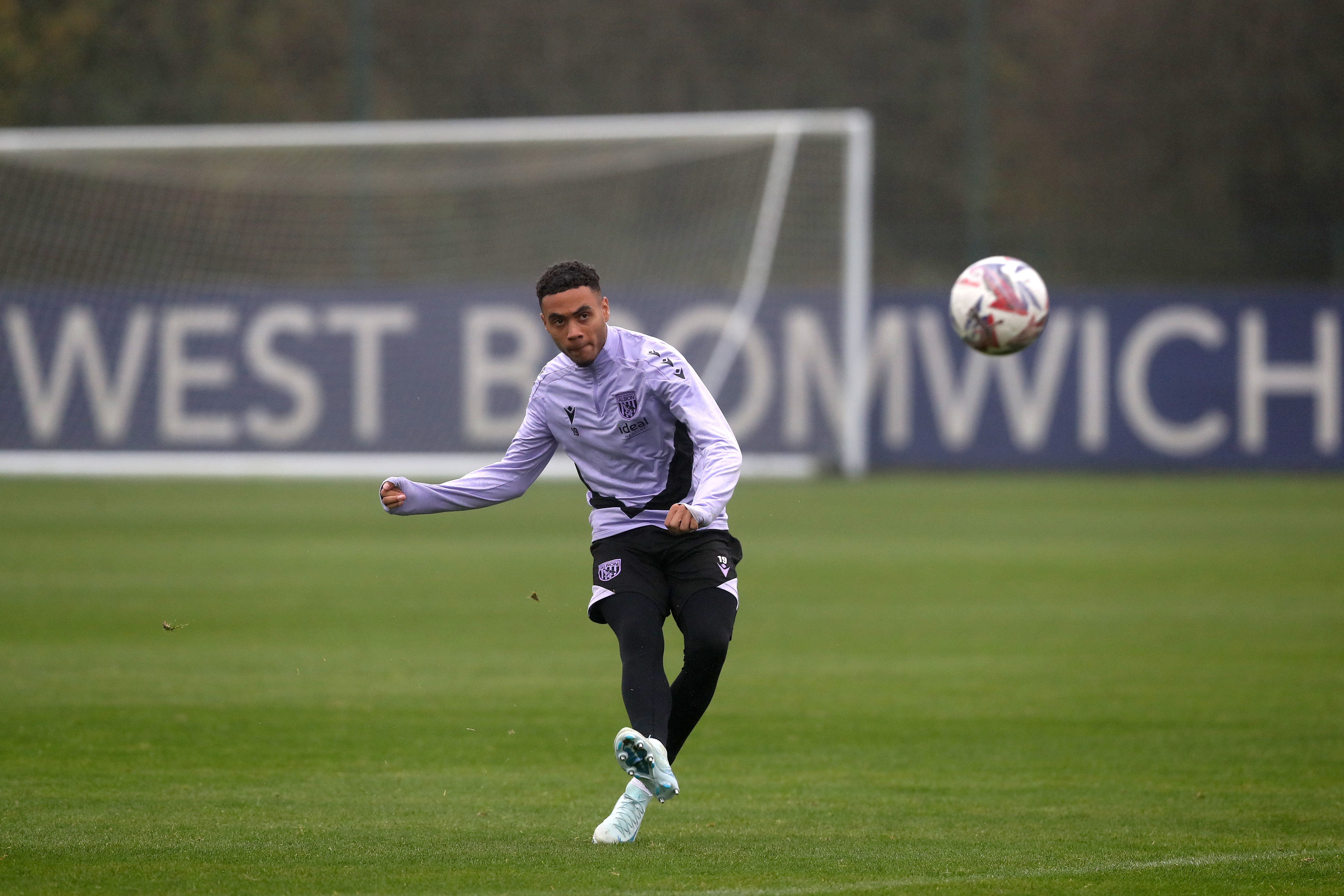 Lewis Dobbin striking the ball during a training session 