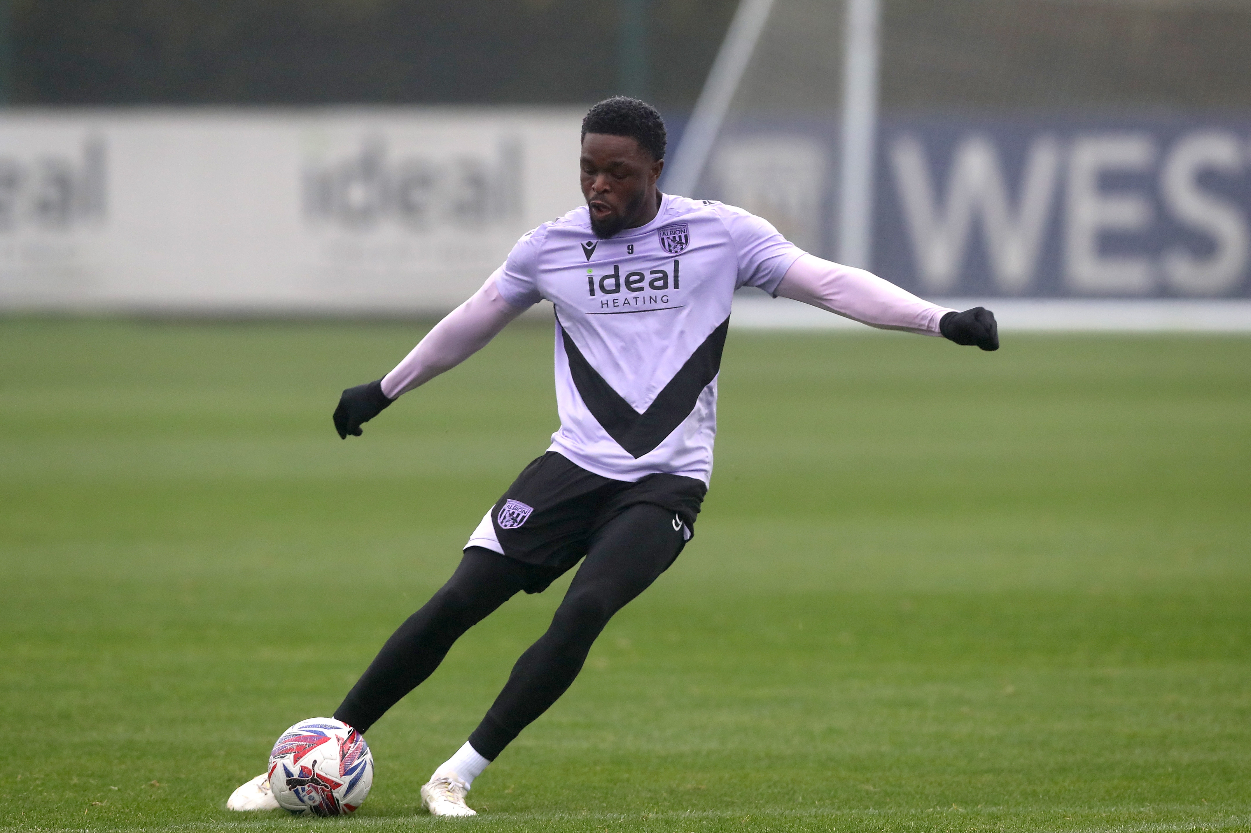 Josh Maja striking the ball during a training session 