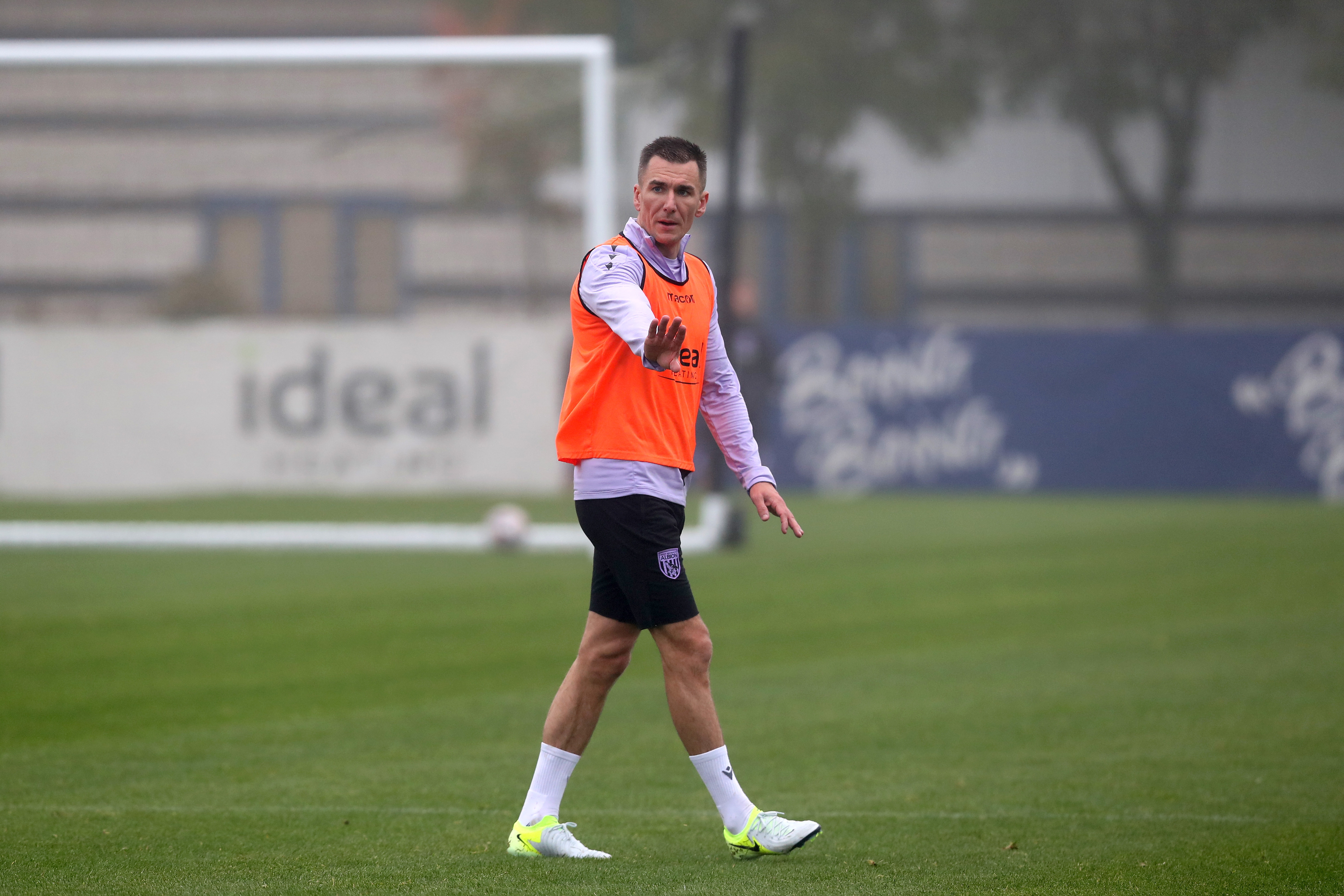 Jed Wallace with his hand outstretched during a training session 