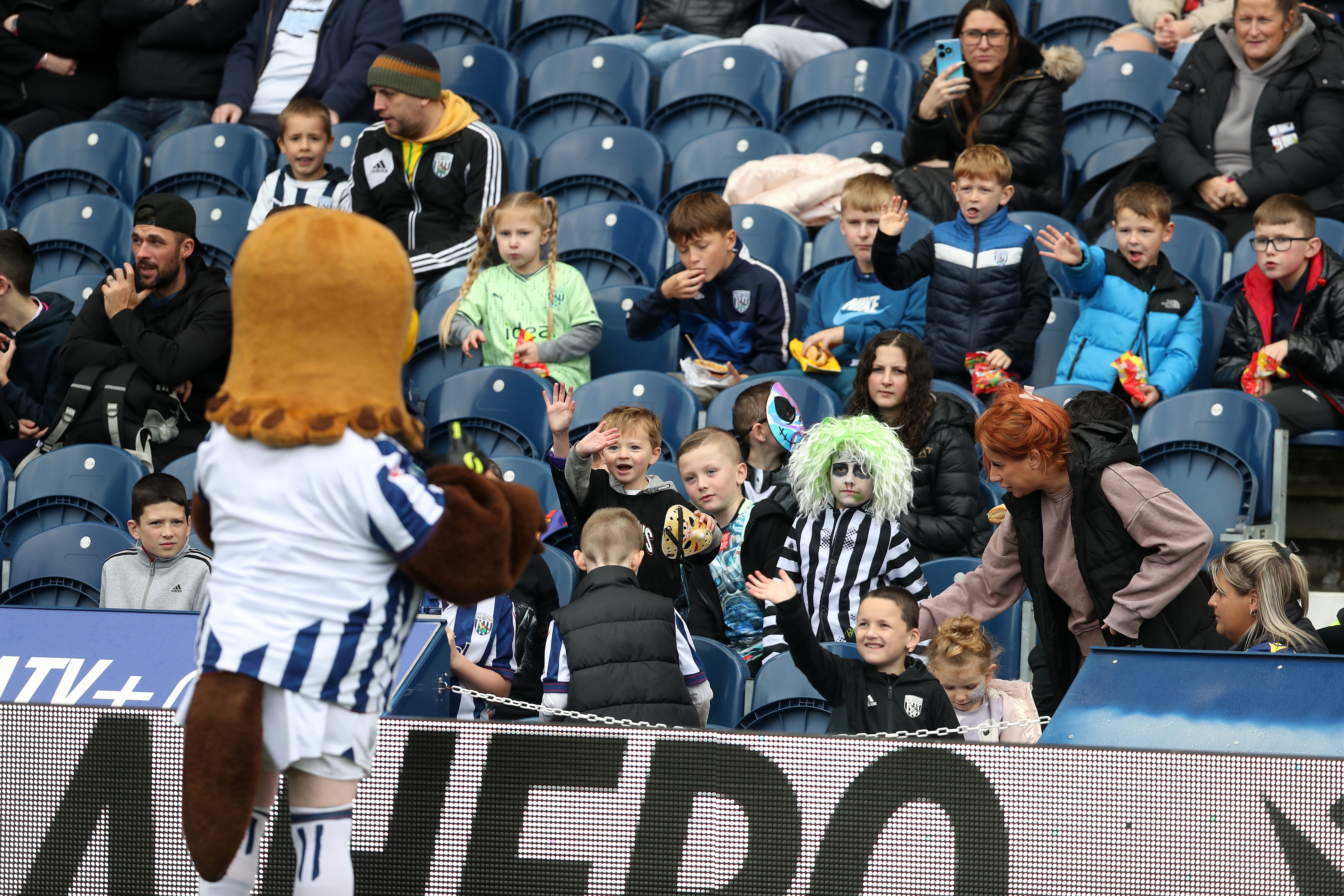 A general view of WBA fans and Baggie Bird in the stand on open training day