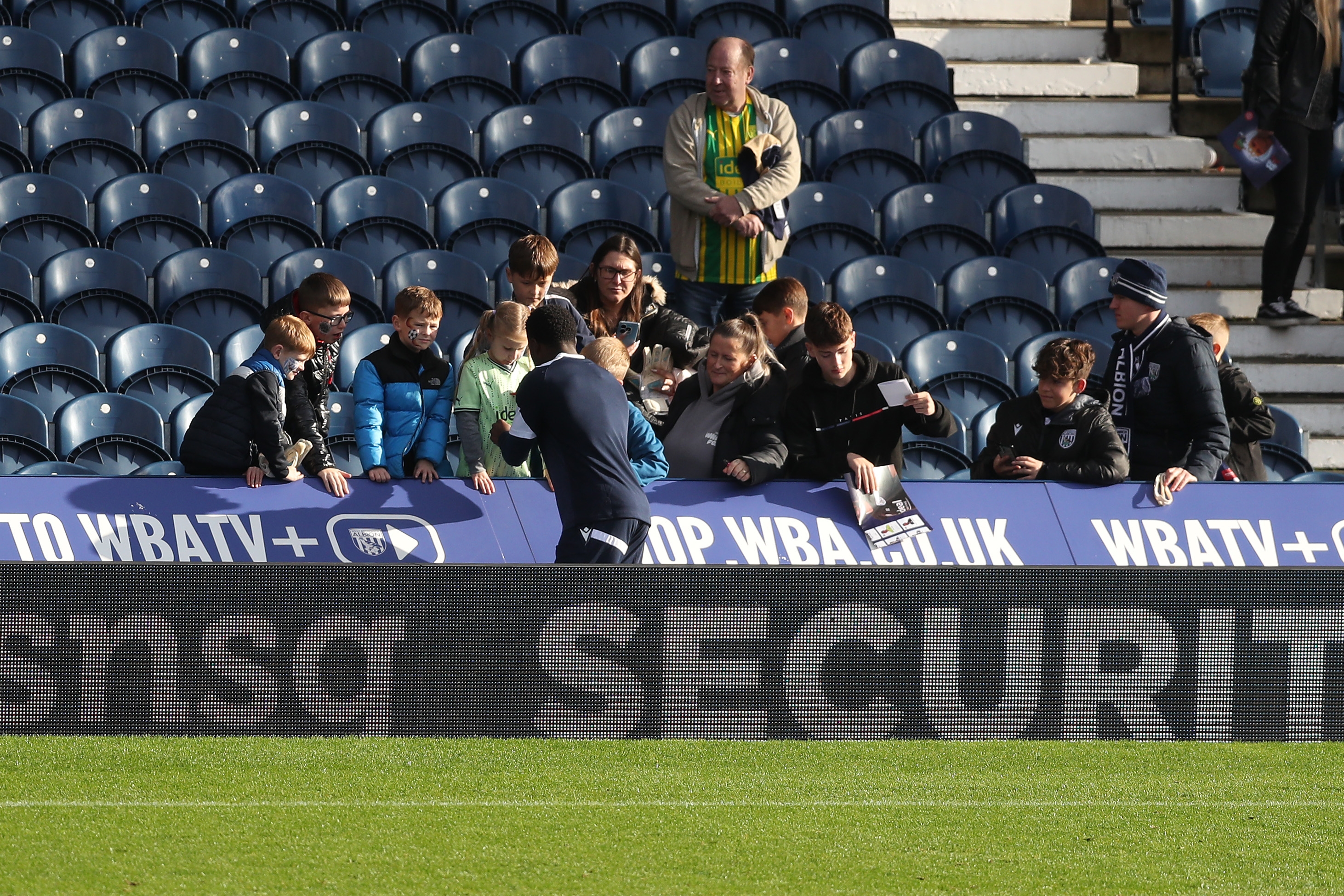 A general view of WBA fans in the stand on open training day