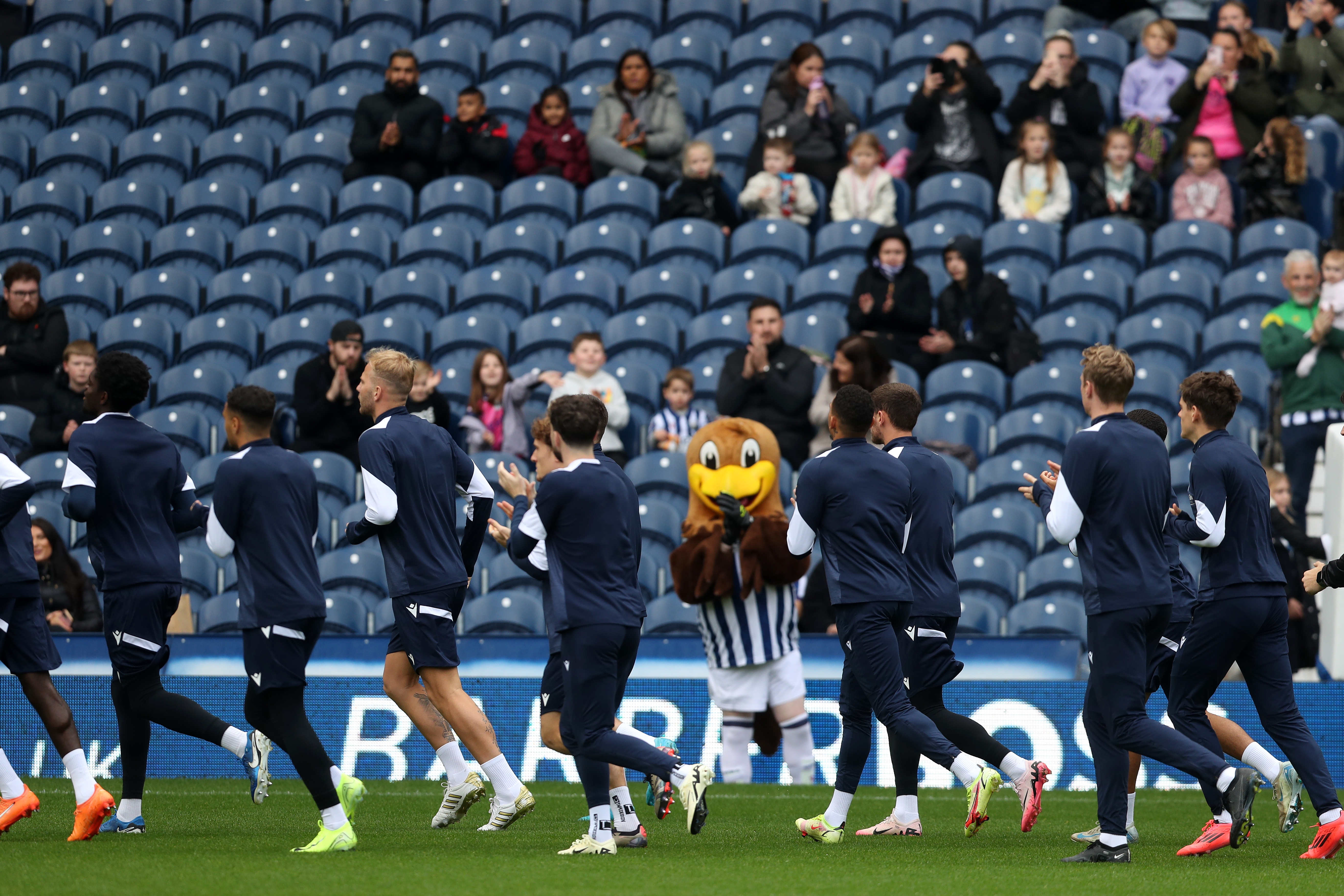 Albion players applaud fans in the stands on open training day