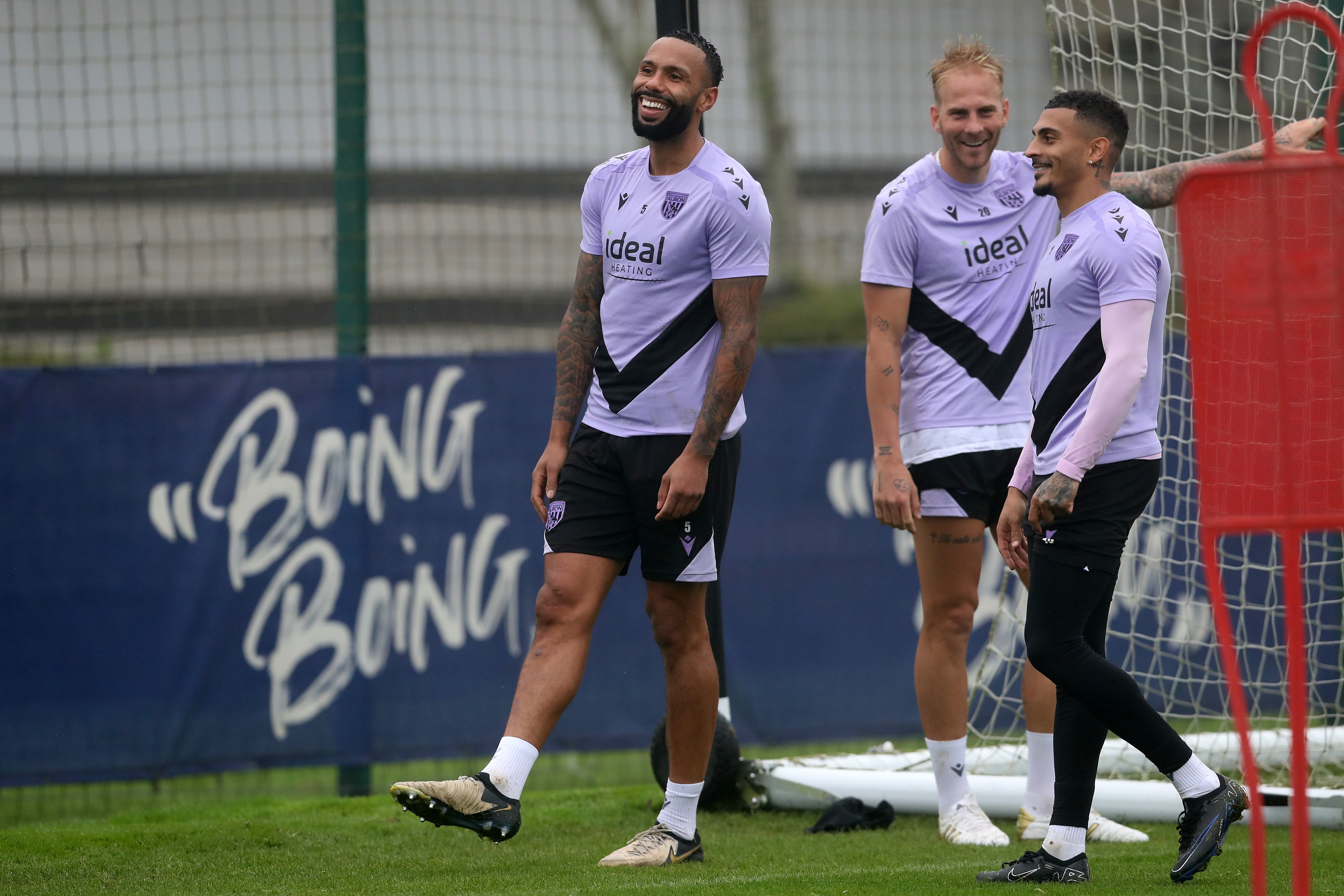 Kyle Bartley, Uroš Račić and Karlan Grant laughing together during a training session 