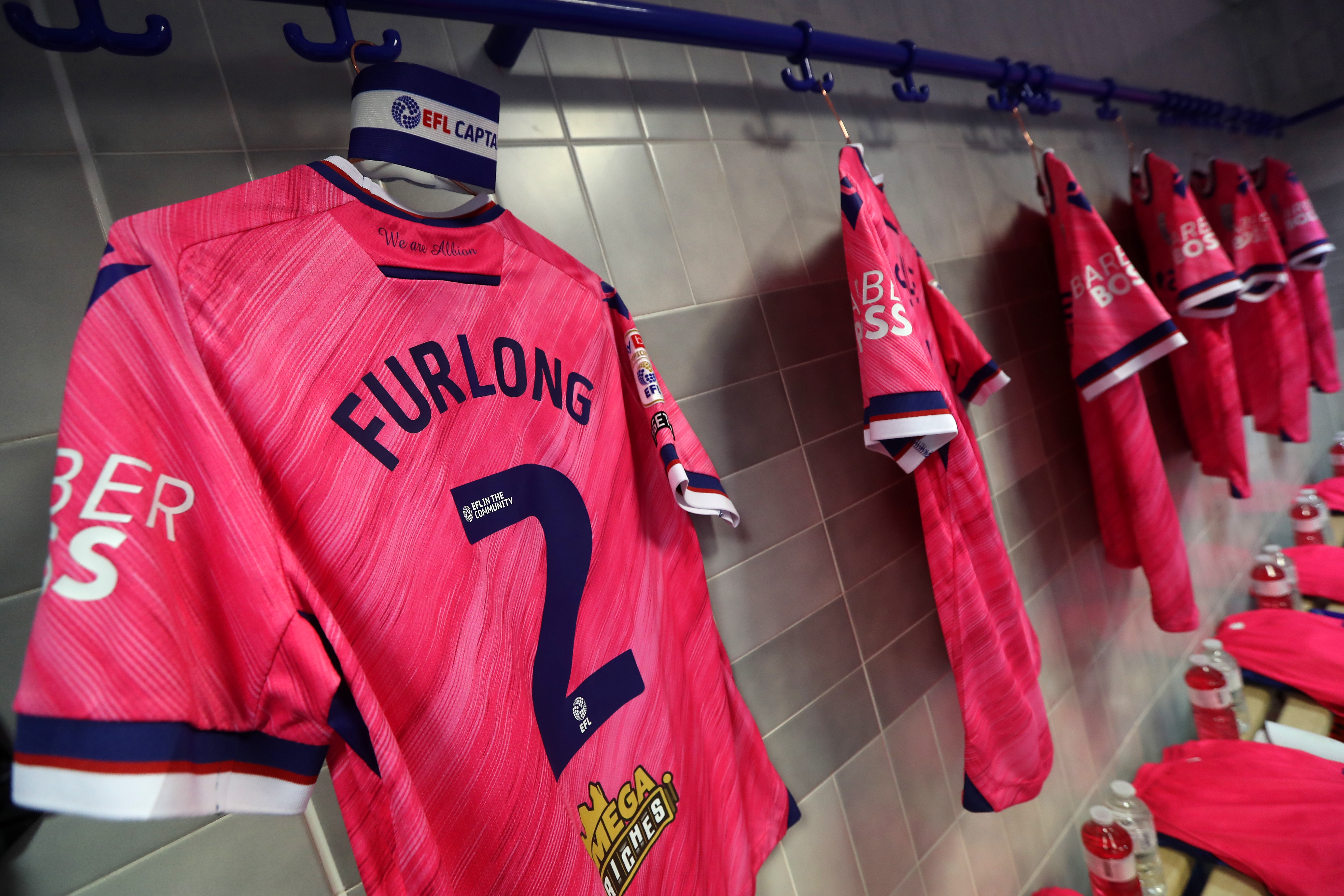 Darnell Furlong's shirt hanging in the dressing room with the captain's armband above it 