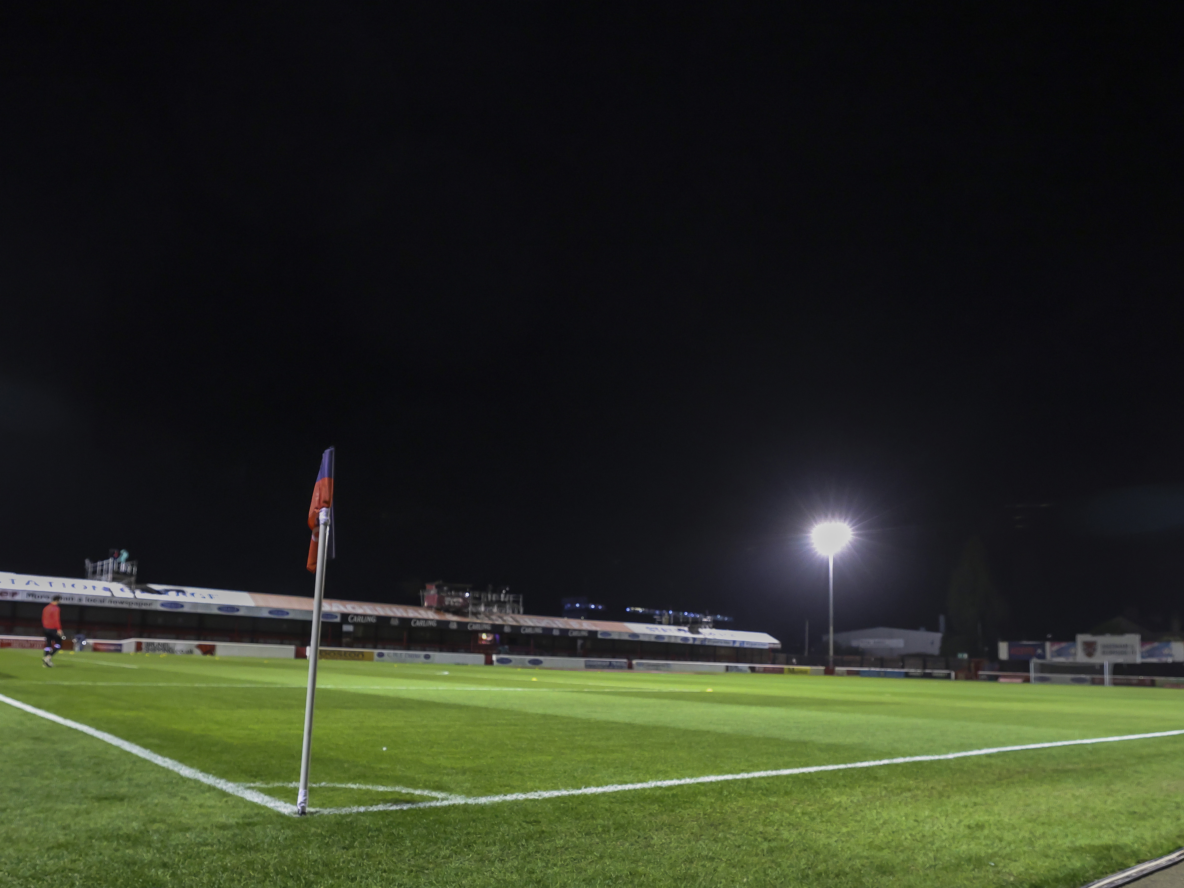 A night time view of Dagenham & Redbridge's Chigwell Construction Stadium 