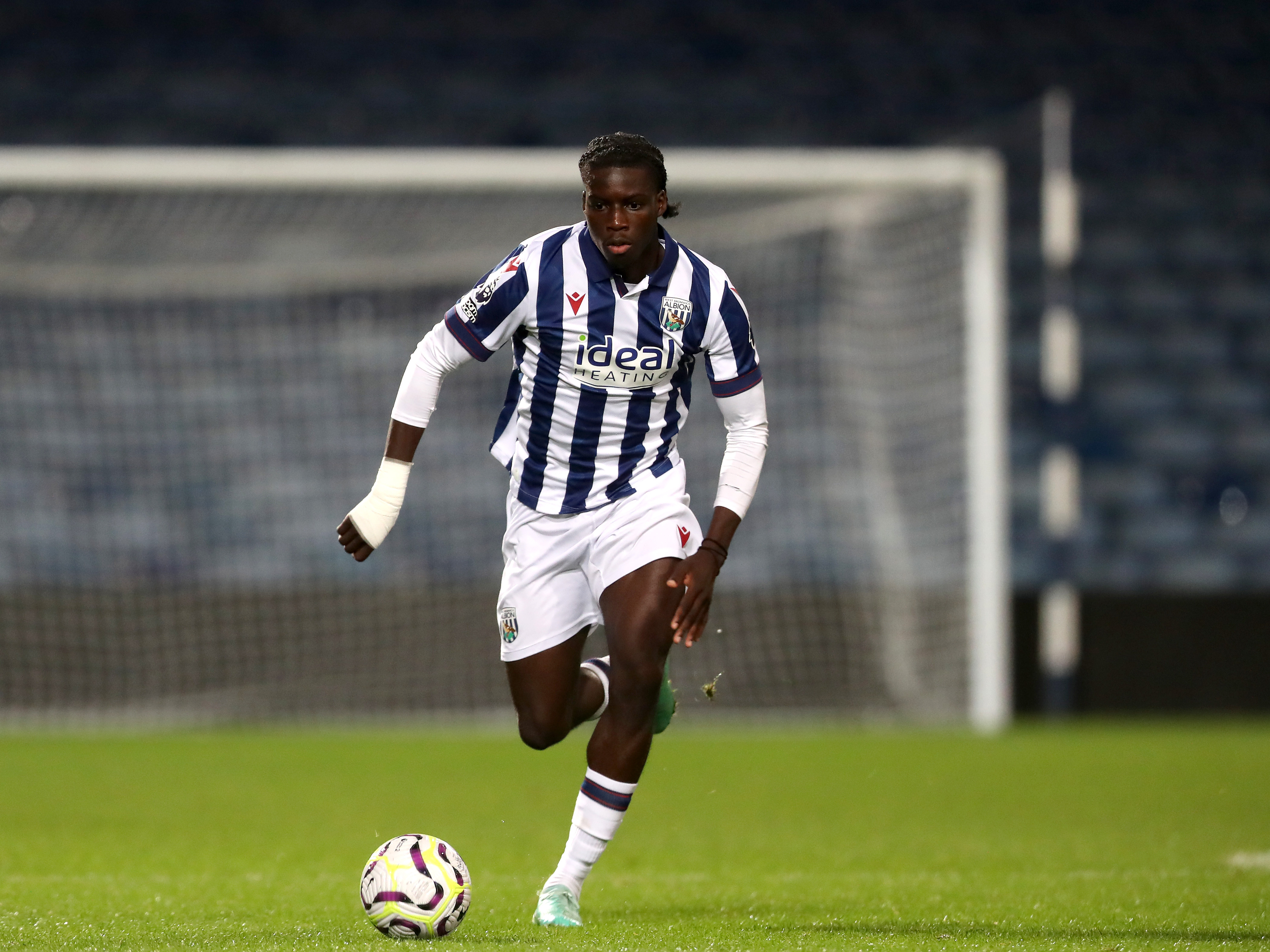 A photo of Albion U21 defender Muhamed Diomande in the 2024/25 home kit