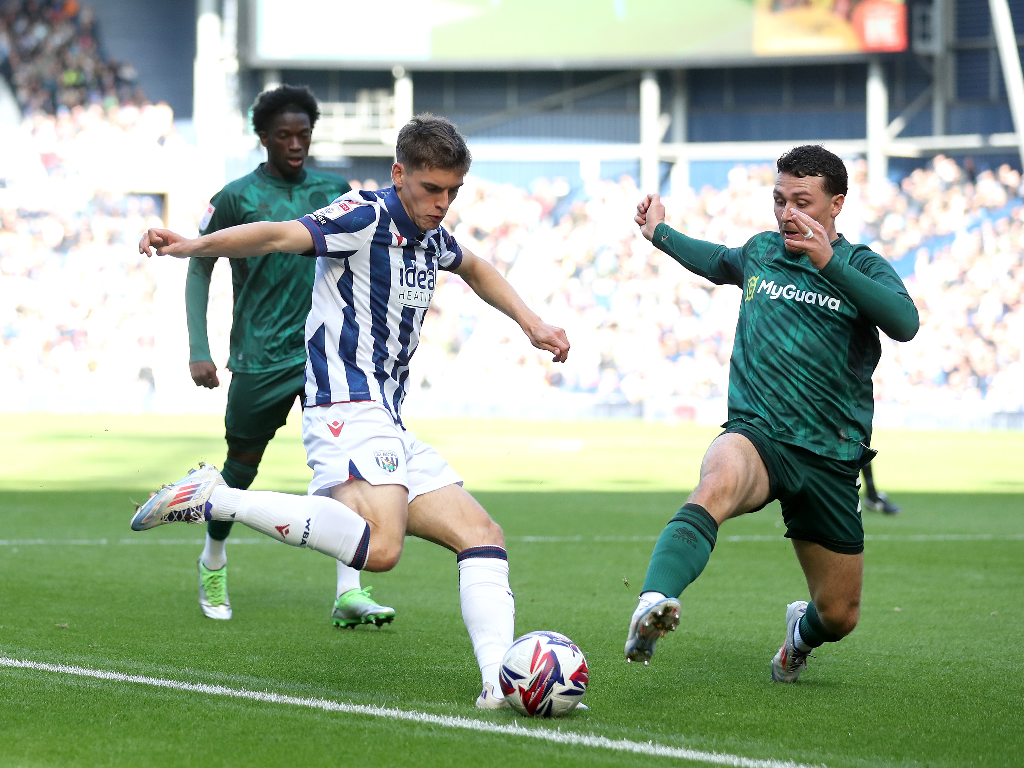 An image of Tom Fellows crossing the ball against Millwall