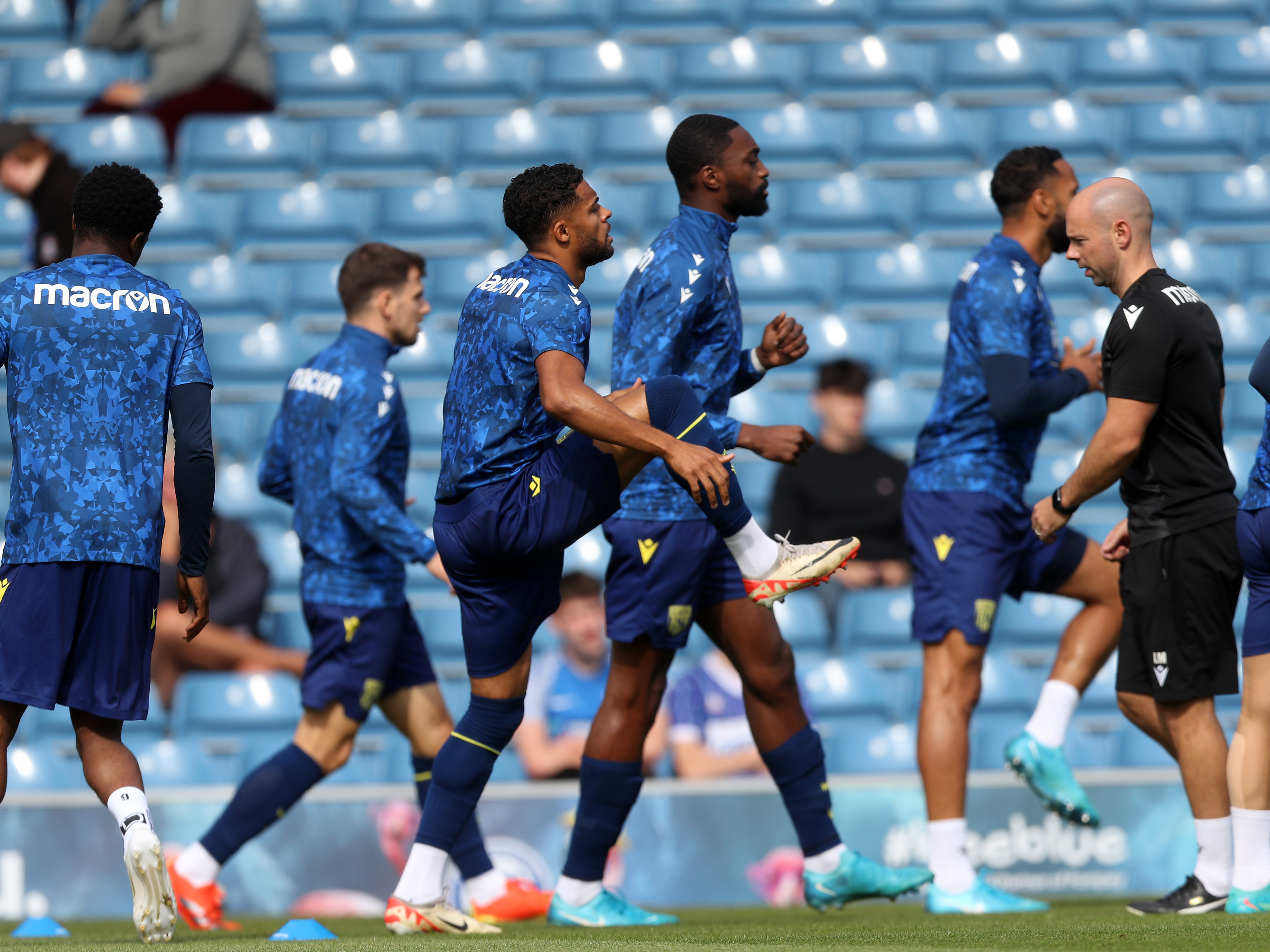 A photo of Darnell Furlong warming up at Portsmouth's Fratton Park