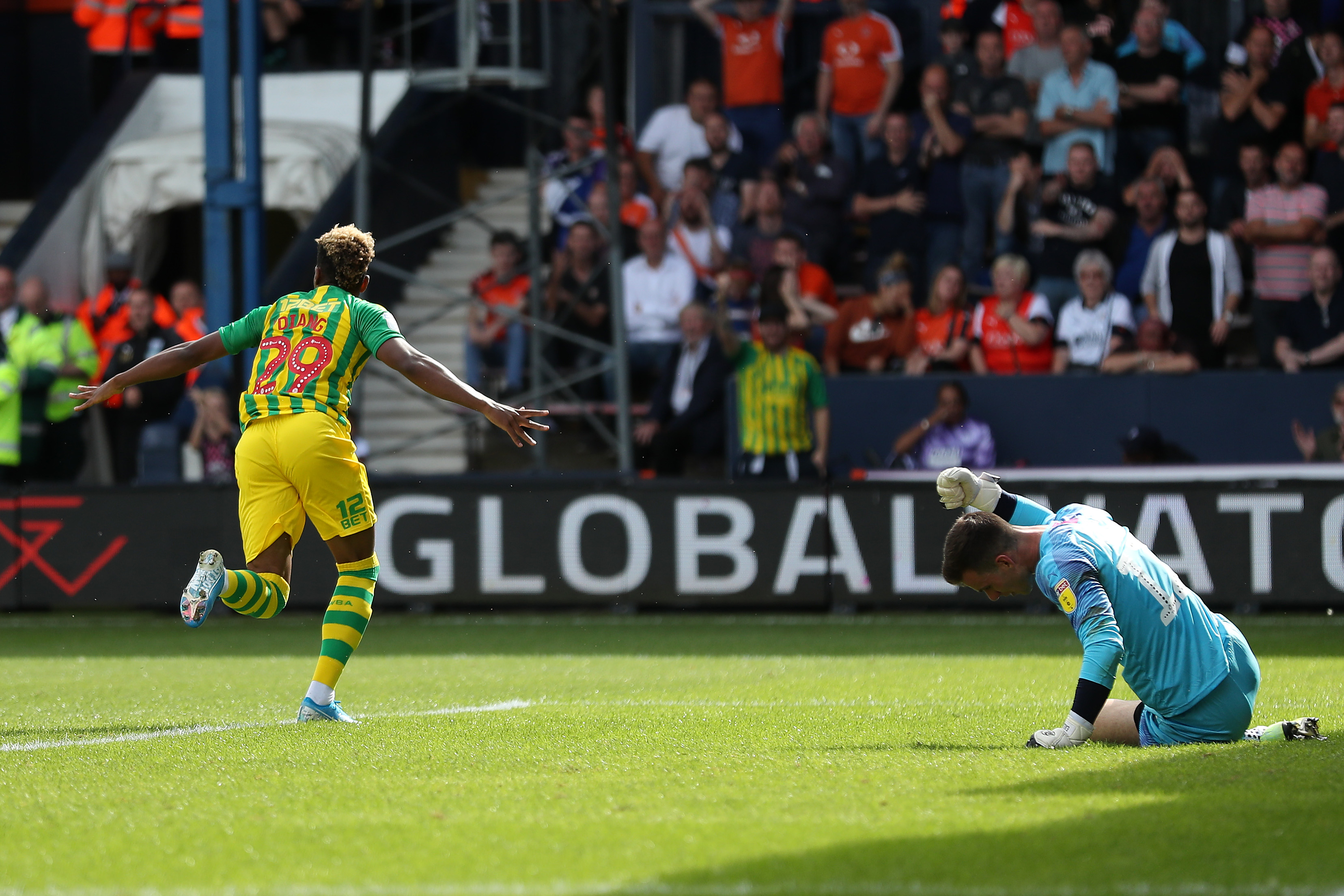 Grady Diangana runs away to celebrate after scoring for Albion at Luton in August 2019