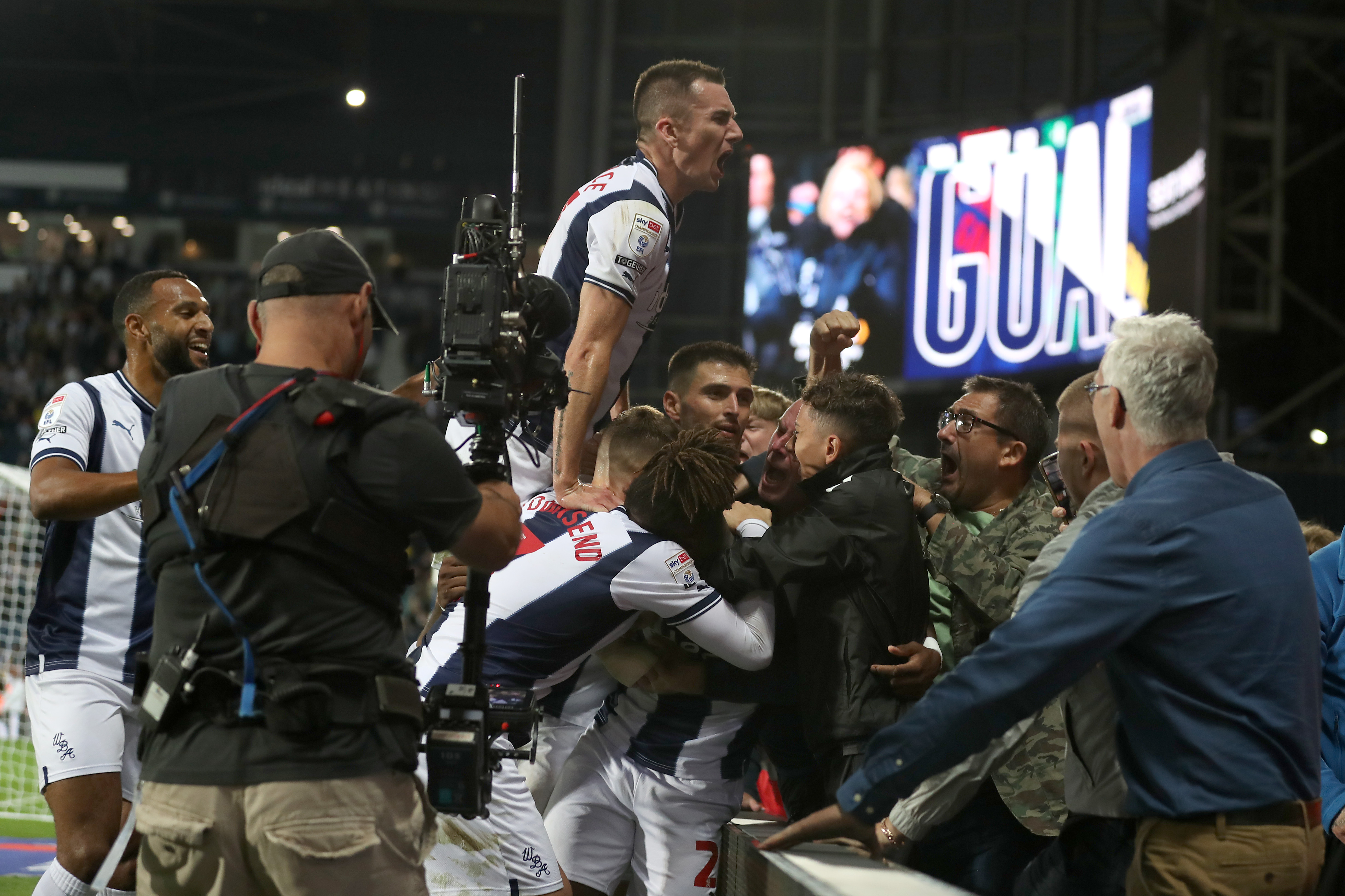 Albion players celebrate a late goal against Burnley at The Hawthorns in September 2022