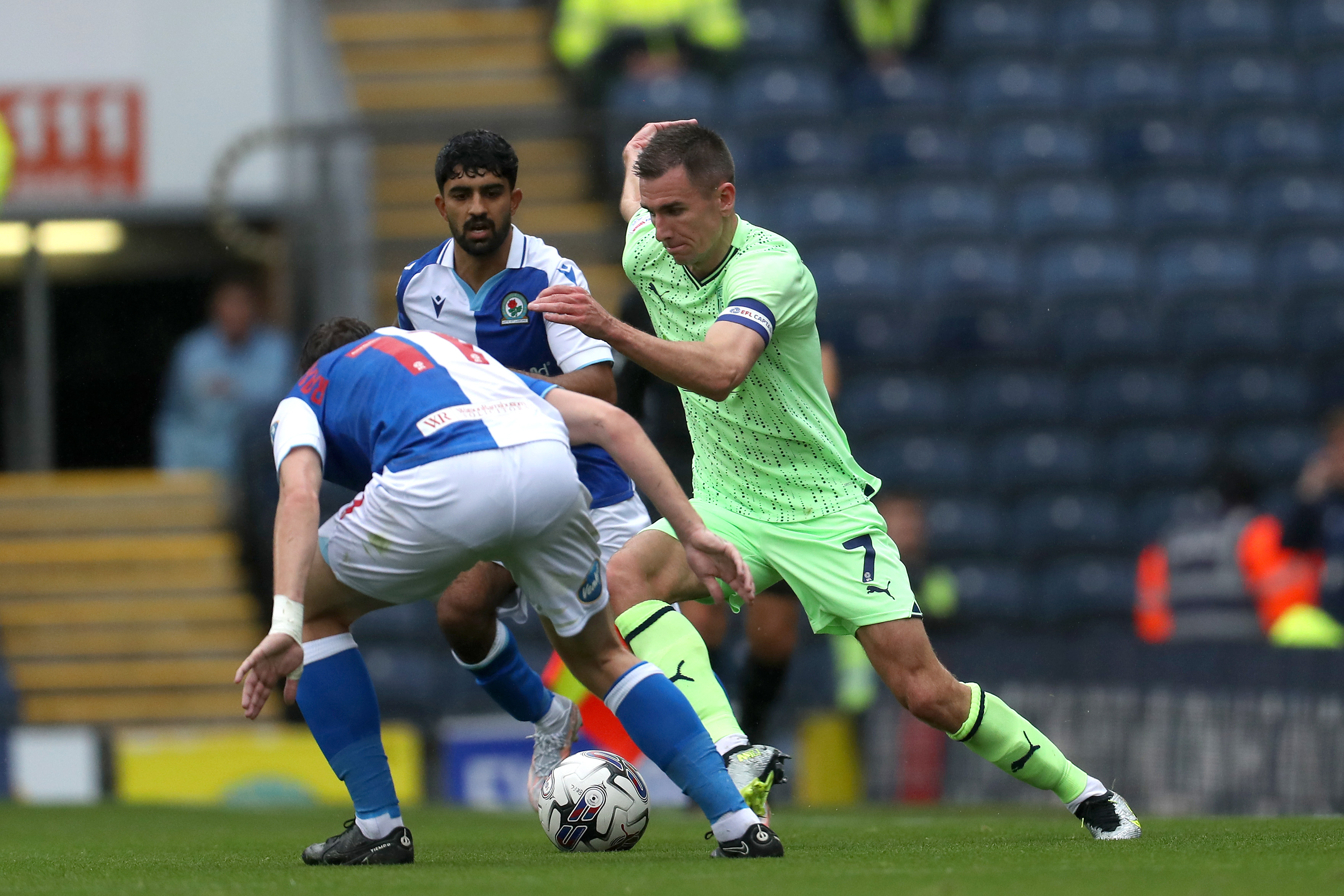 Jed Wallace in action for Albion at Blackburn in August 2023 in the lime green kit 