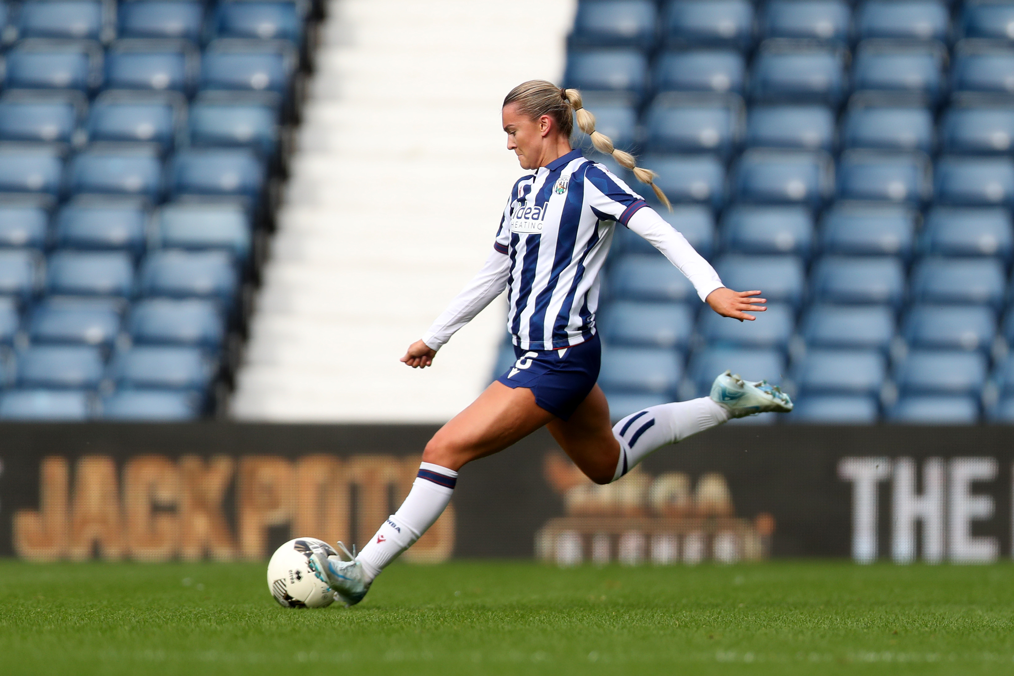 Taylor Reynolds in action for Albion at The Hawthorns wearing the home kit 