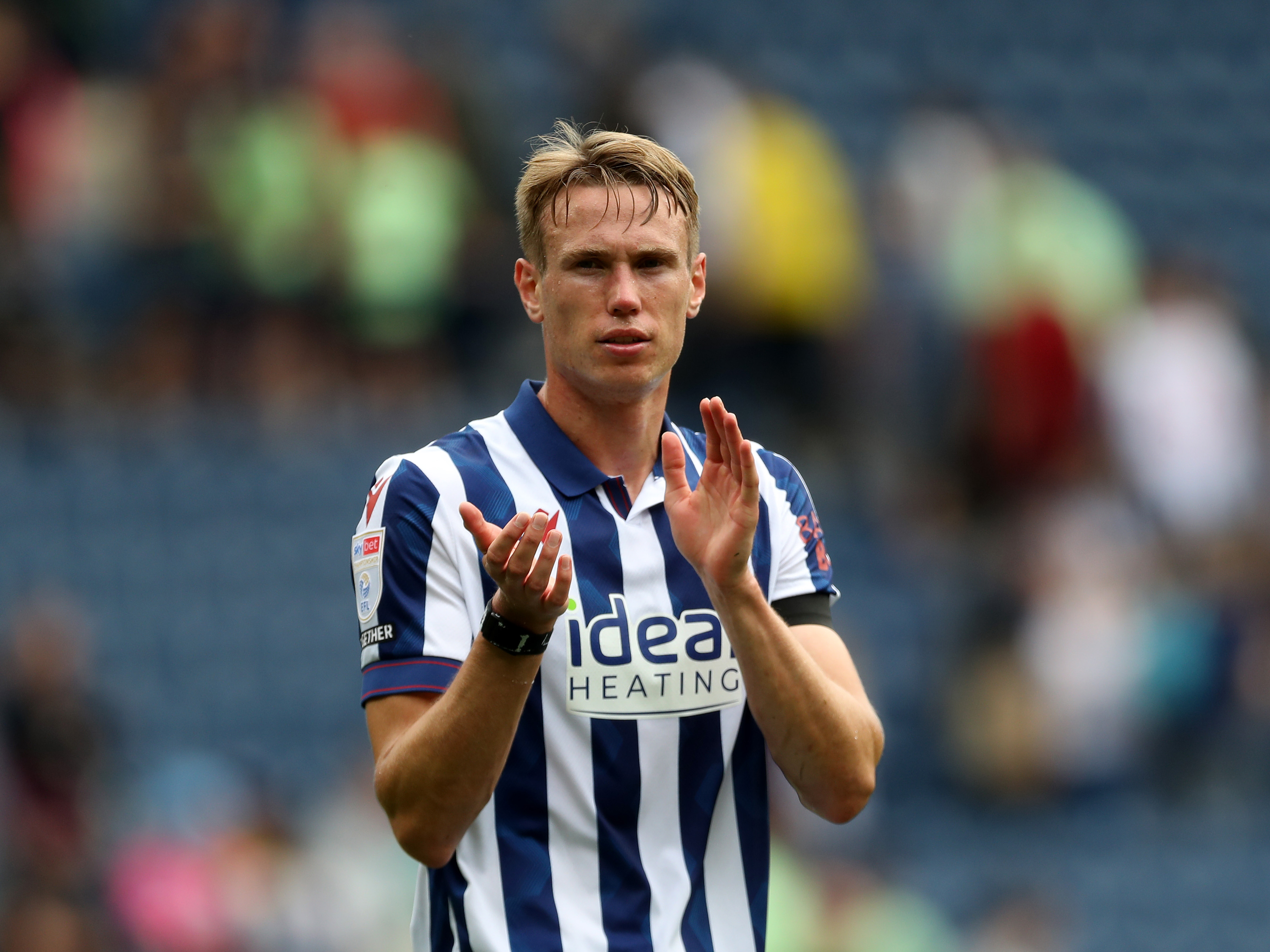 Torbjørn Heggem applauding Albion fans while wearing the home kit 