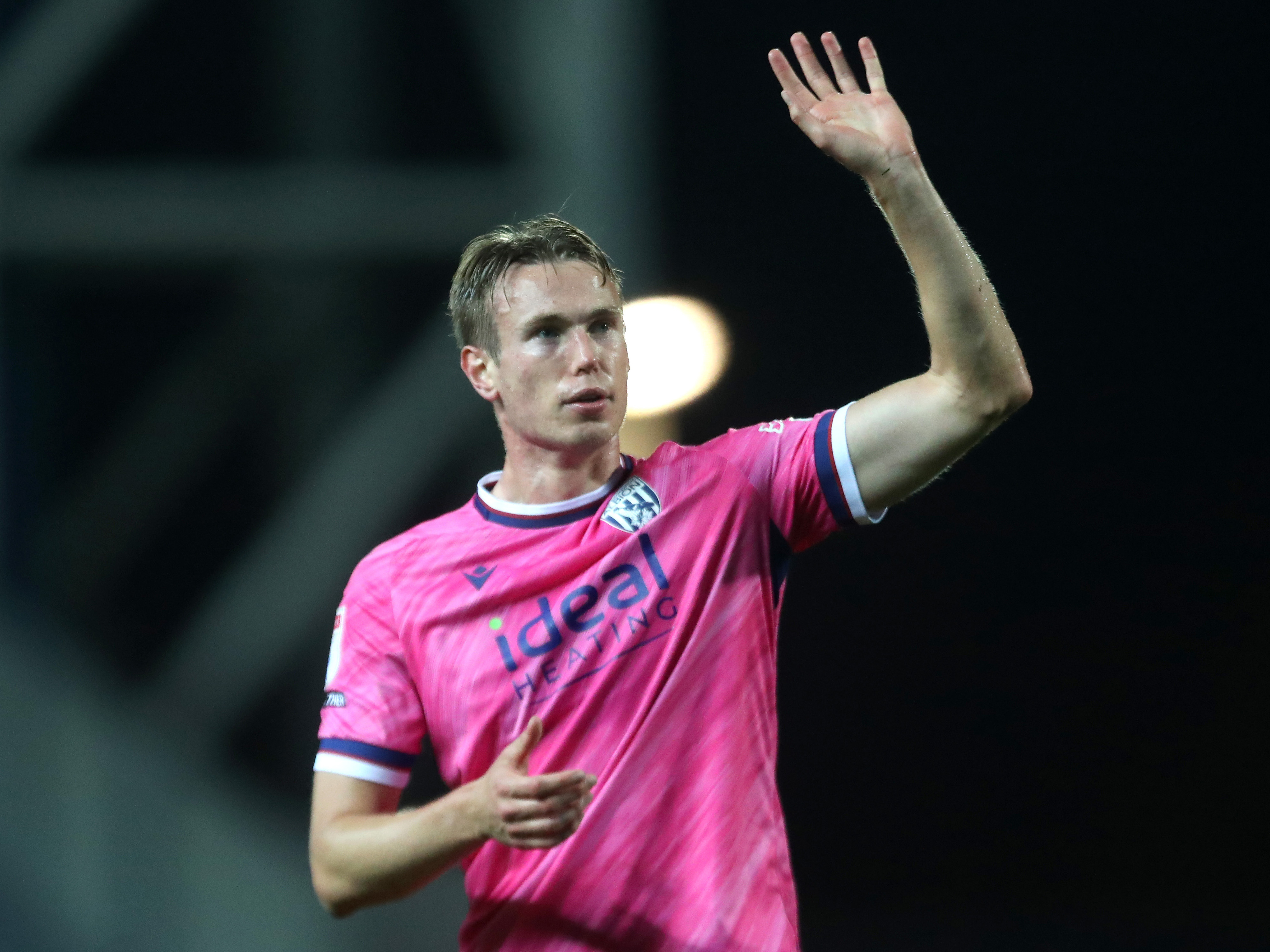 Torbjørn Heggem waving at Albion fans in the pink kit at Blackburn 