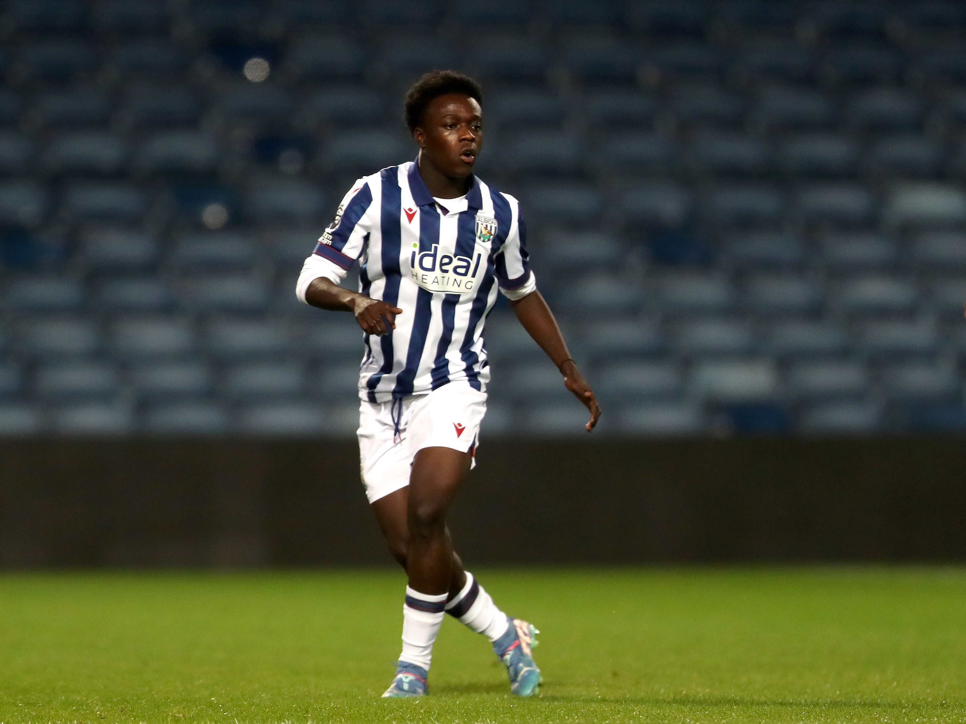 A photo of U18s midfielder Dauda Iddrisa, in the 2024/25 home kit, in action at The Hawthorns