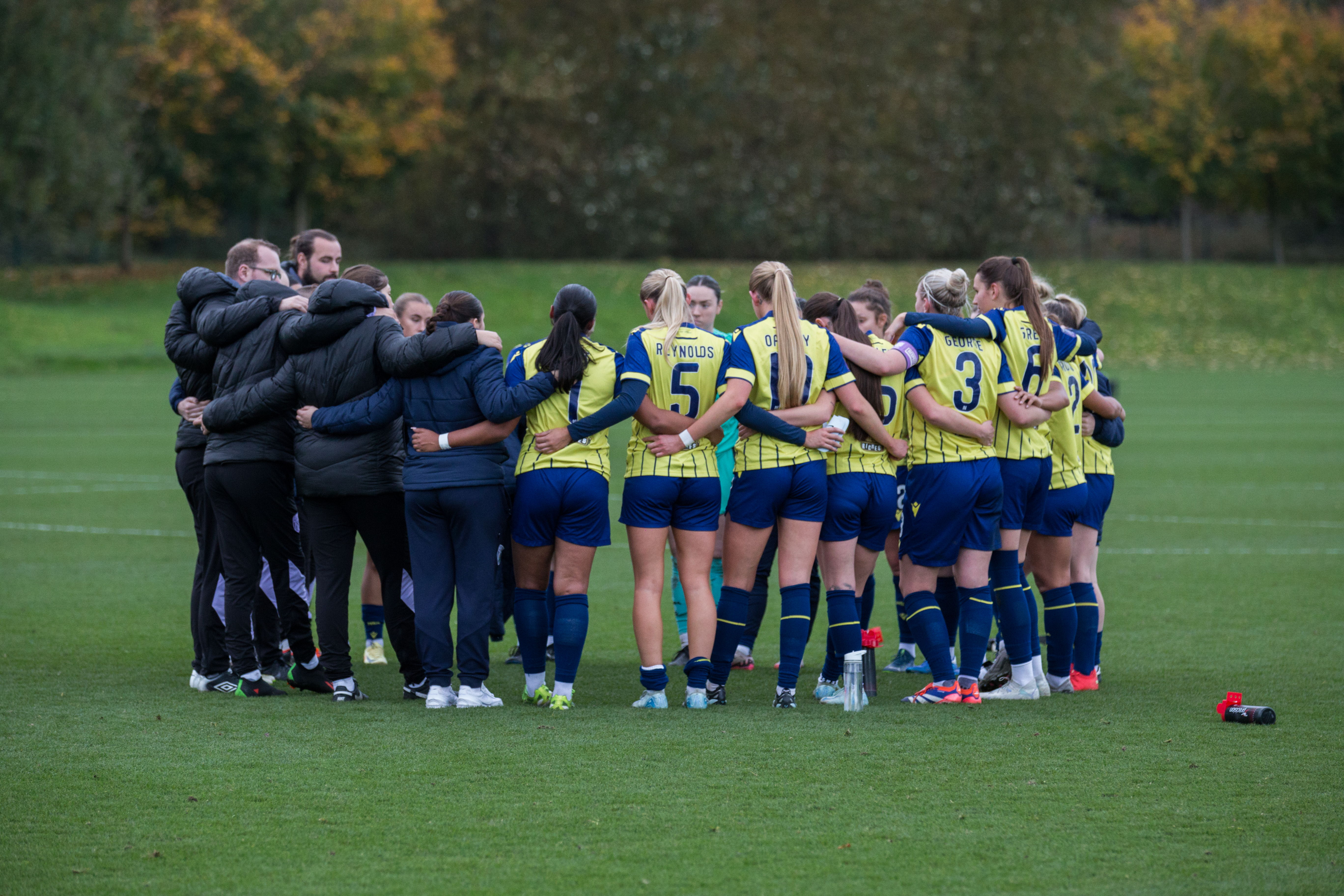 Albion Women in a huddle.