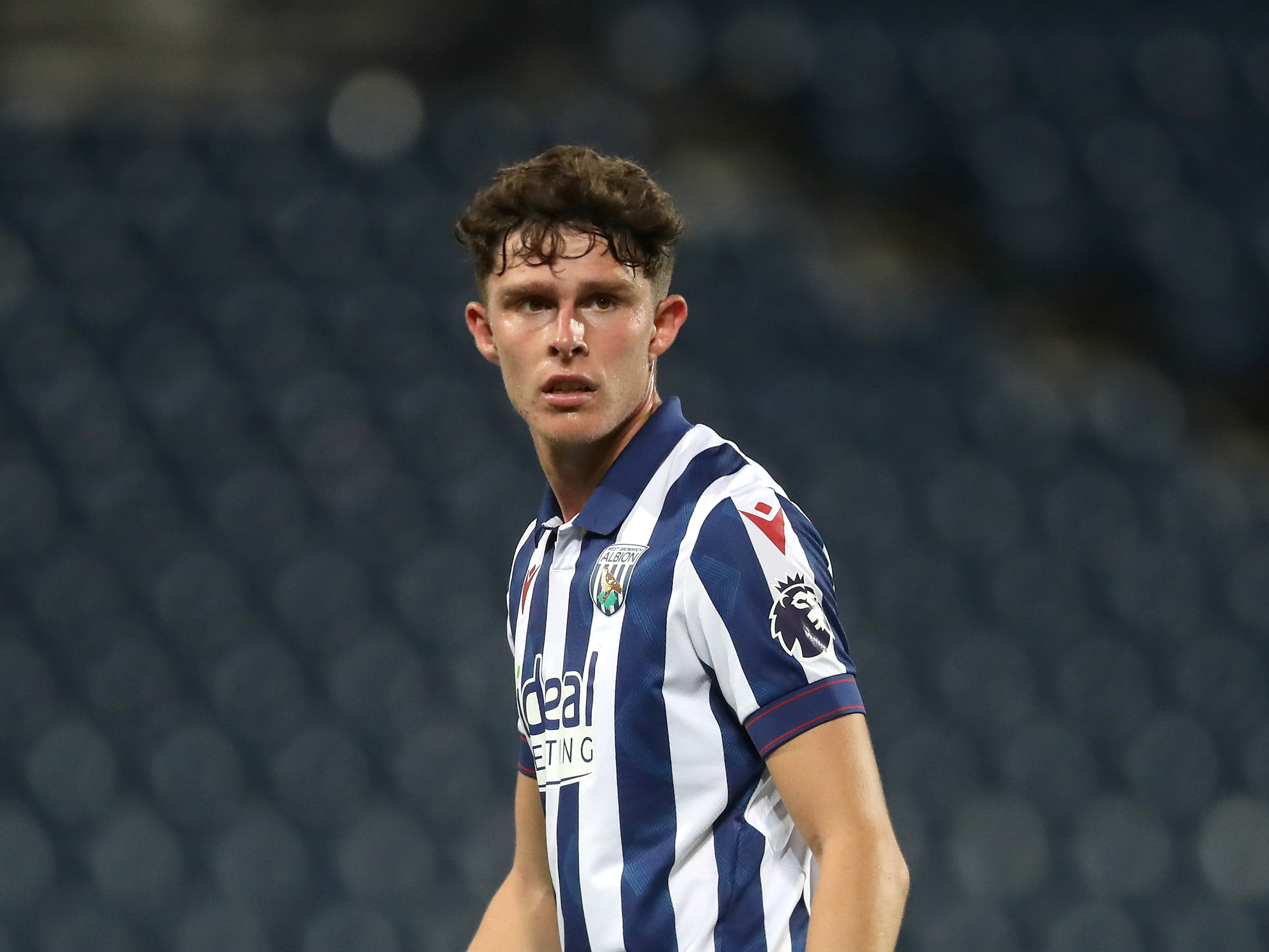 A photo of Albion u21s midfielder Matt Richards, in the 2024/25 home kit, in action at The Hawthorns