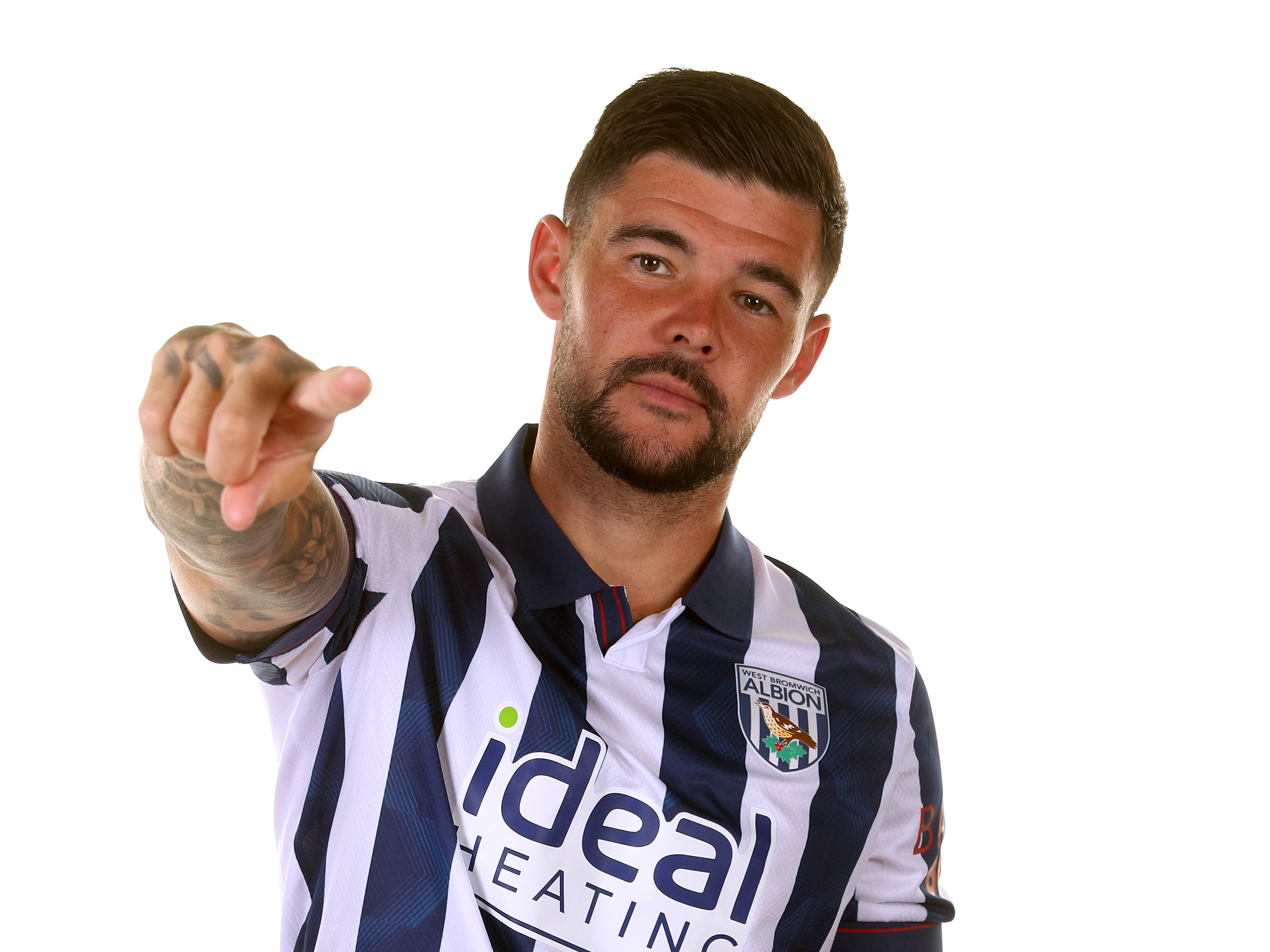 A photo of Alex Mowatt in the 2024/25 home kit