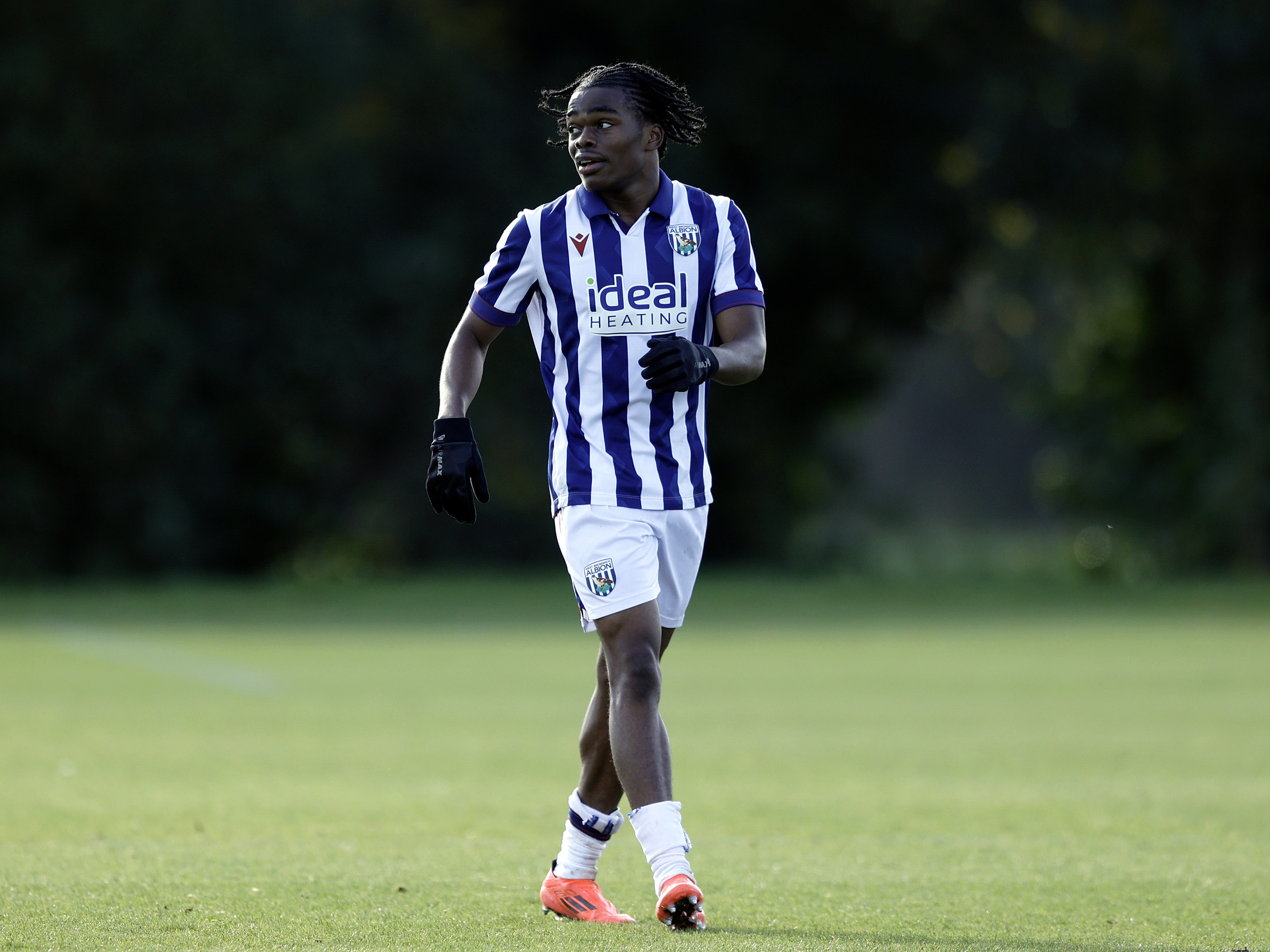 A photo of U18s Divine Onyemachi in the 2024/25 home kit