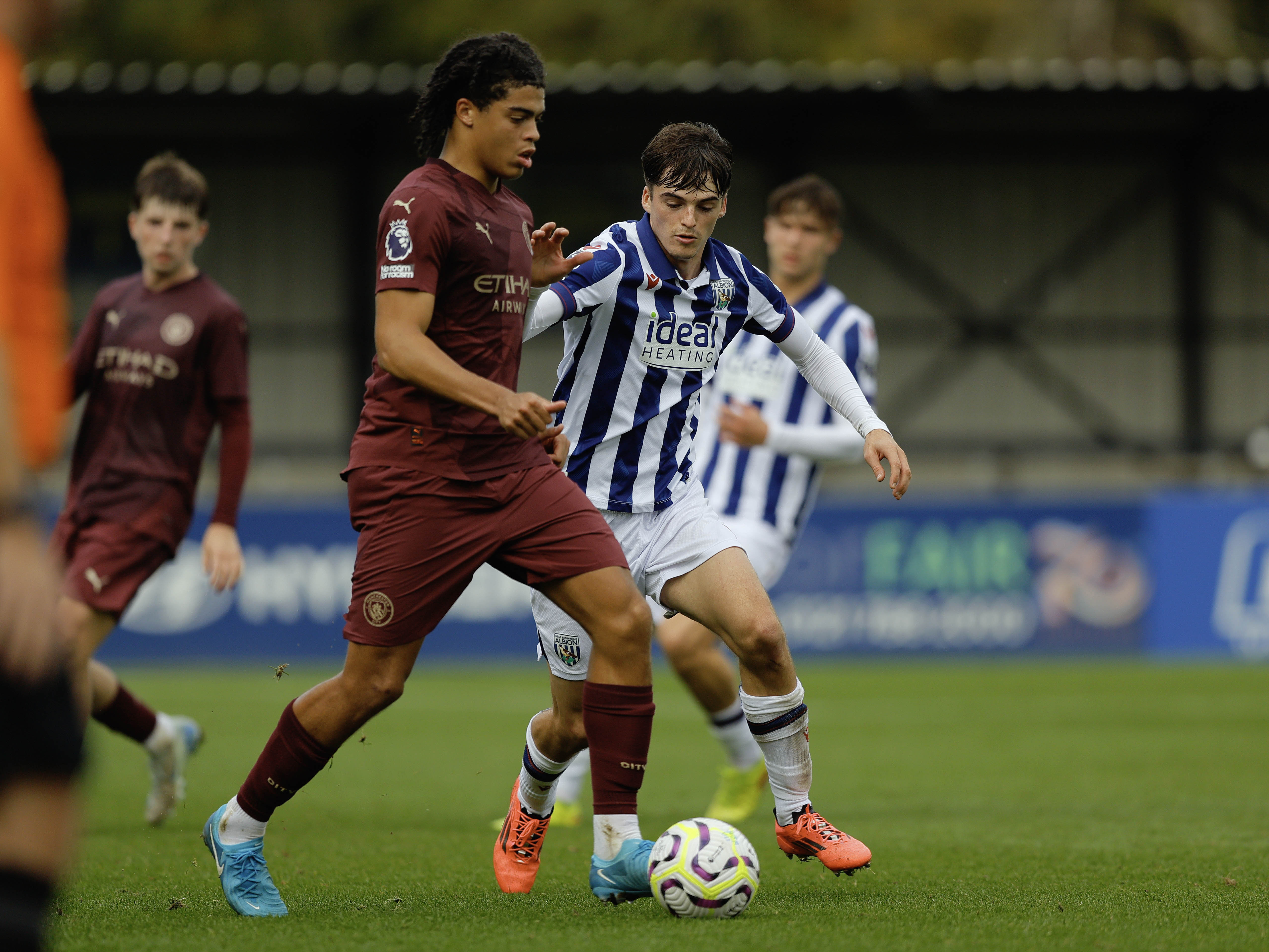 A photo of Albion U21 defender Alex Williams in action v Man City in the 2024/25 home kit