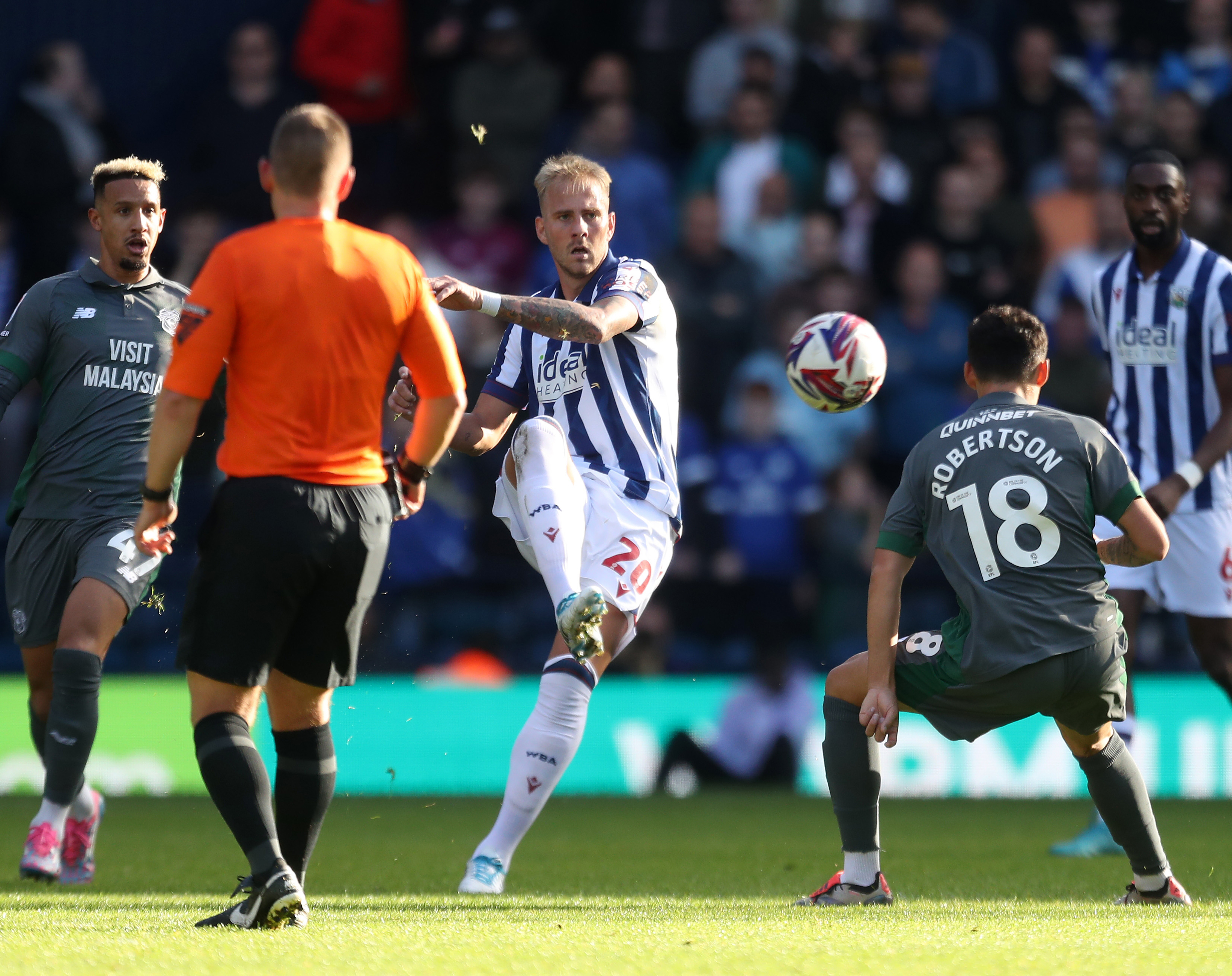 An image of Uros Racic passing the ball against Cardiff