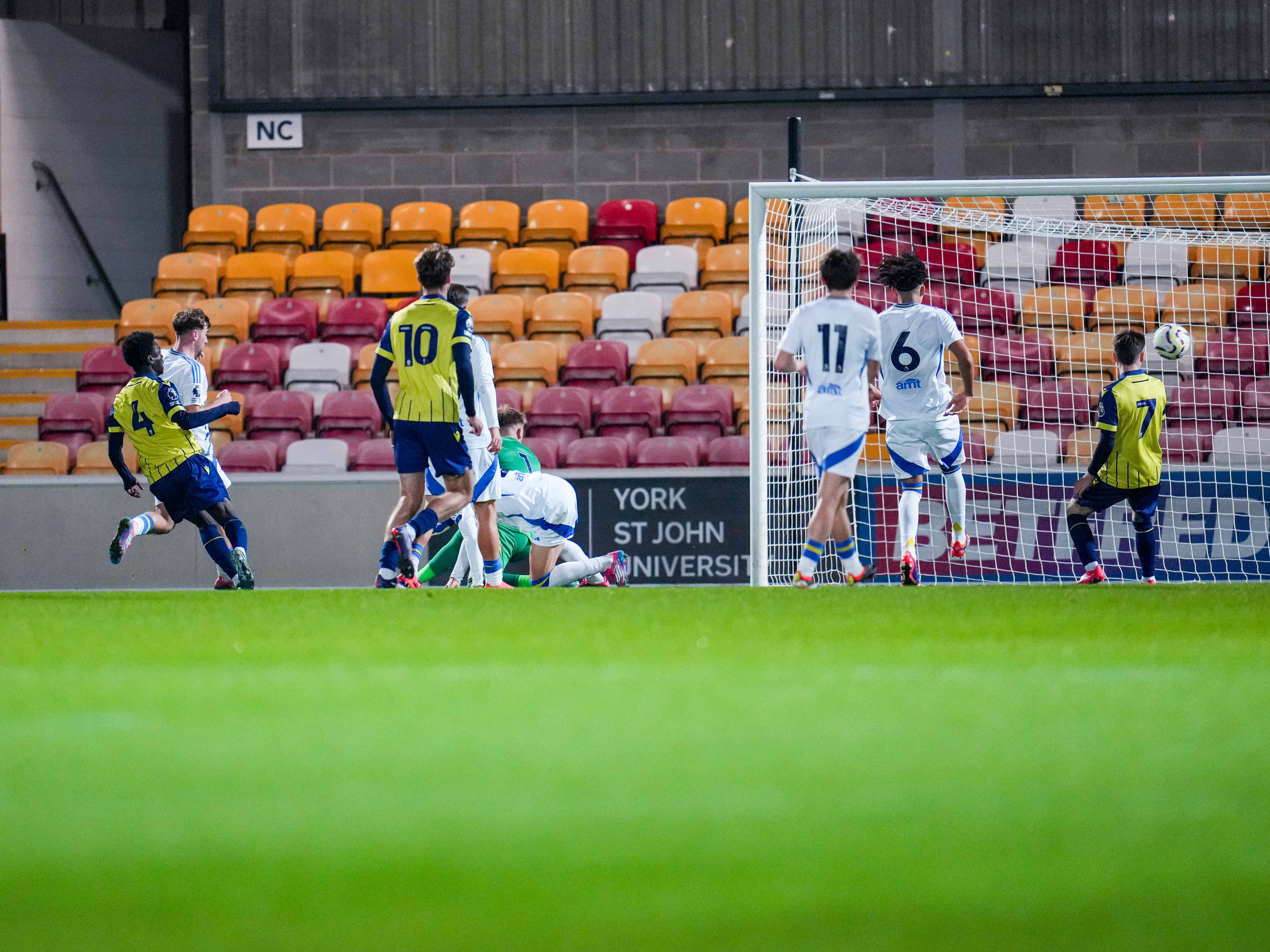 A photo of Albion U18s midfielder Dauda Iddrisa scoring for the PL2 team in the 2024/25 yellow and blue kit v Leeds United