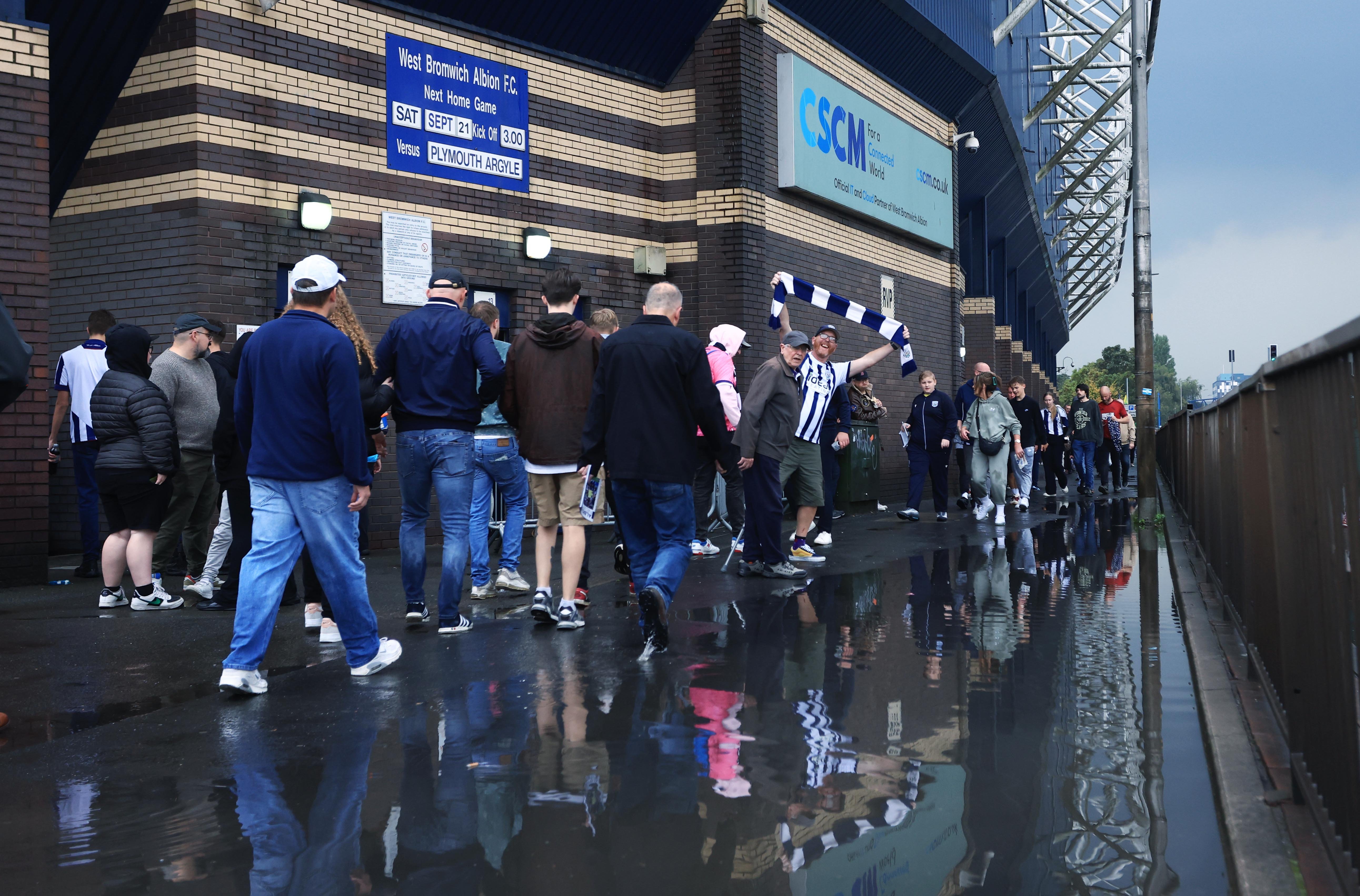 A general view of Albion fans walking to a game at The Hawthorns behind the Birmingham Road End 