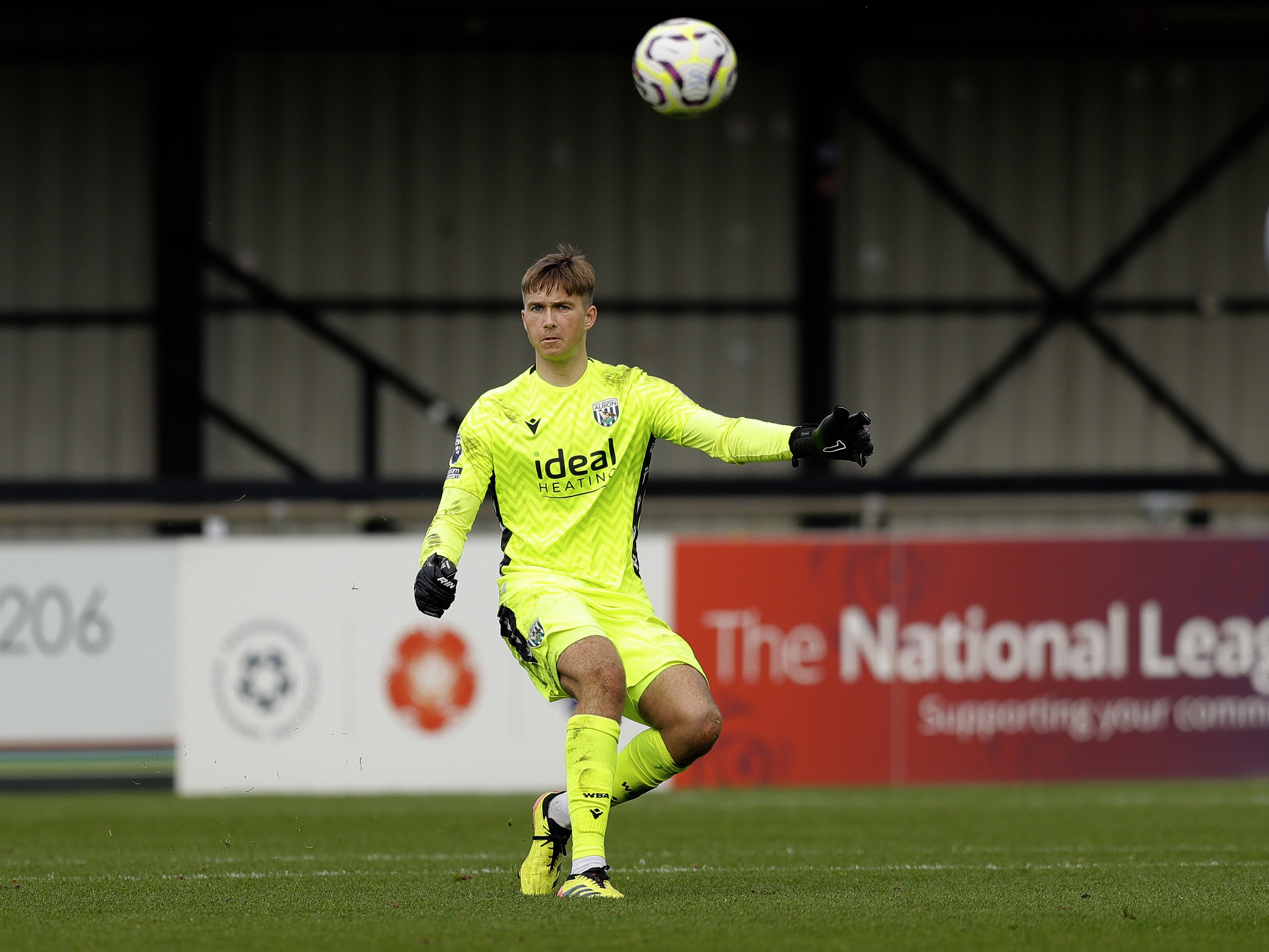 An action shot of Albion u21 goalkeeper Joe Wallis, wearing the 2024/25 yellow goalkeeper kit