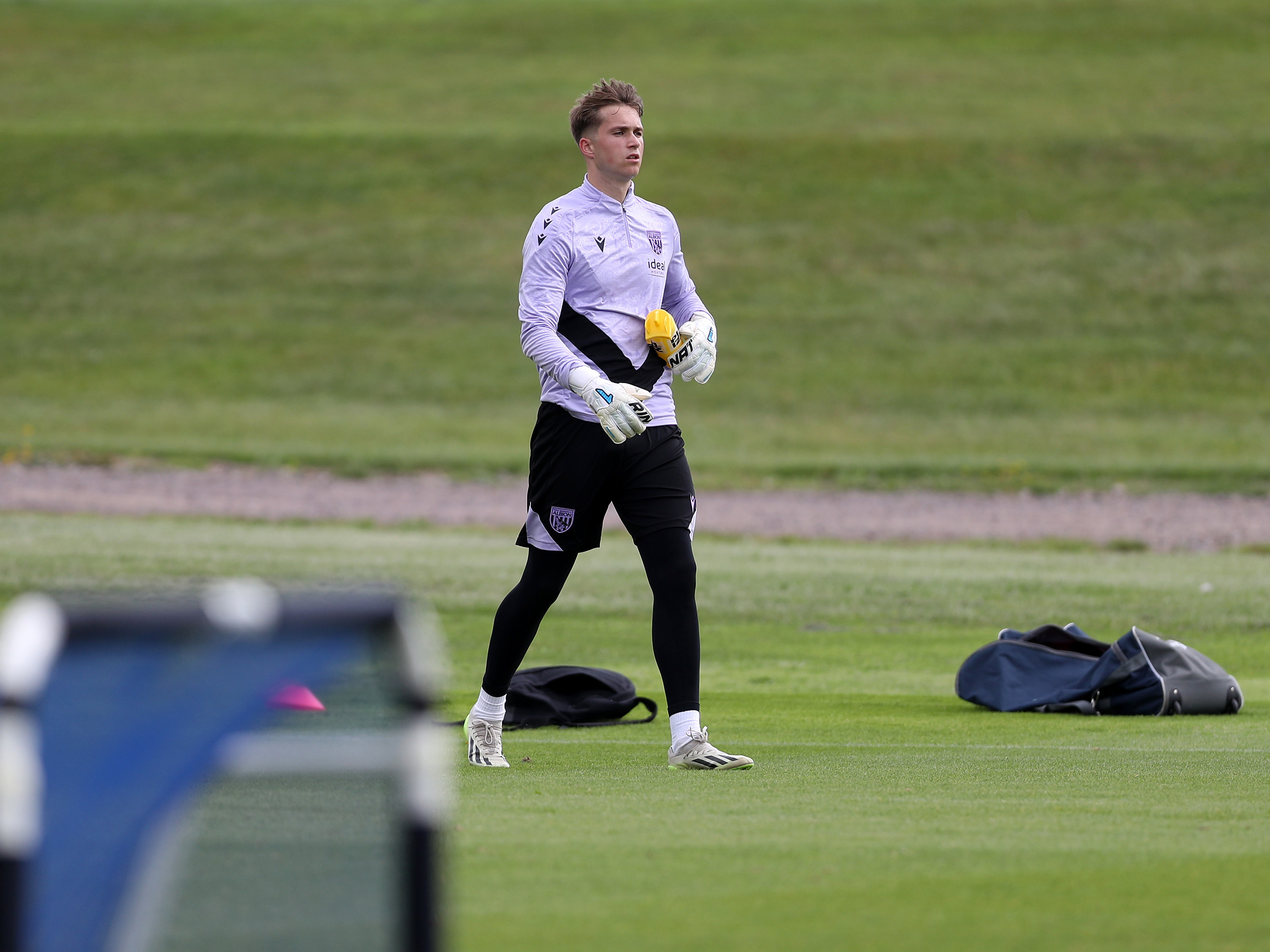 A photo of U21 keeper Joe Wallis in the 2024/25 purple training wear