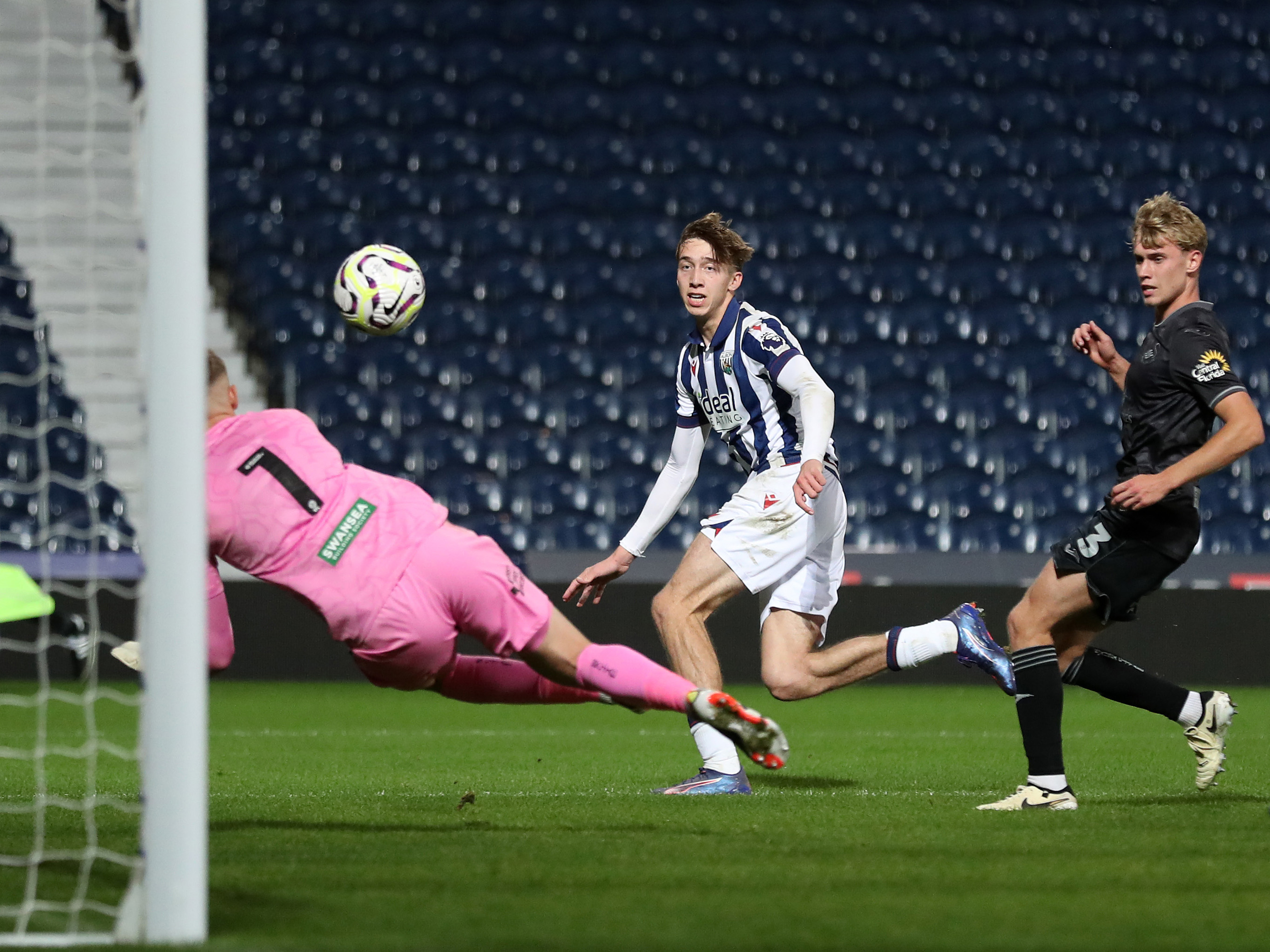 A photo of U21s midfielder Harry Whitwell, in the 2024/25 home kit, in action at The Hawthorns