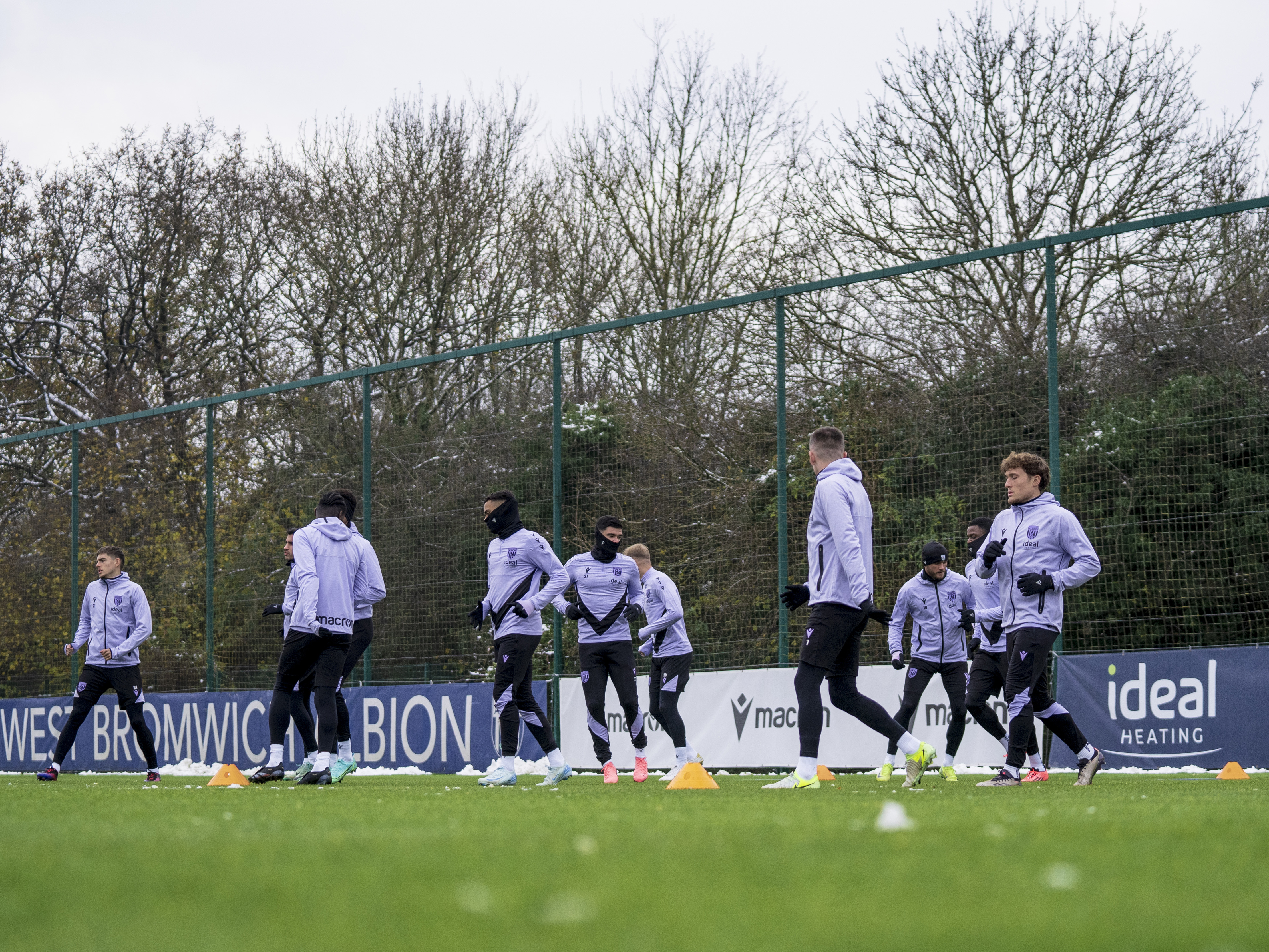 A general view of Albion players warming up before a training session 