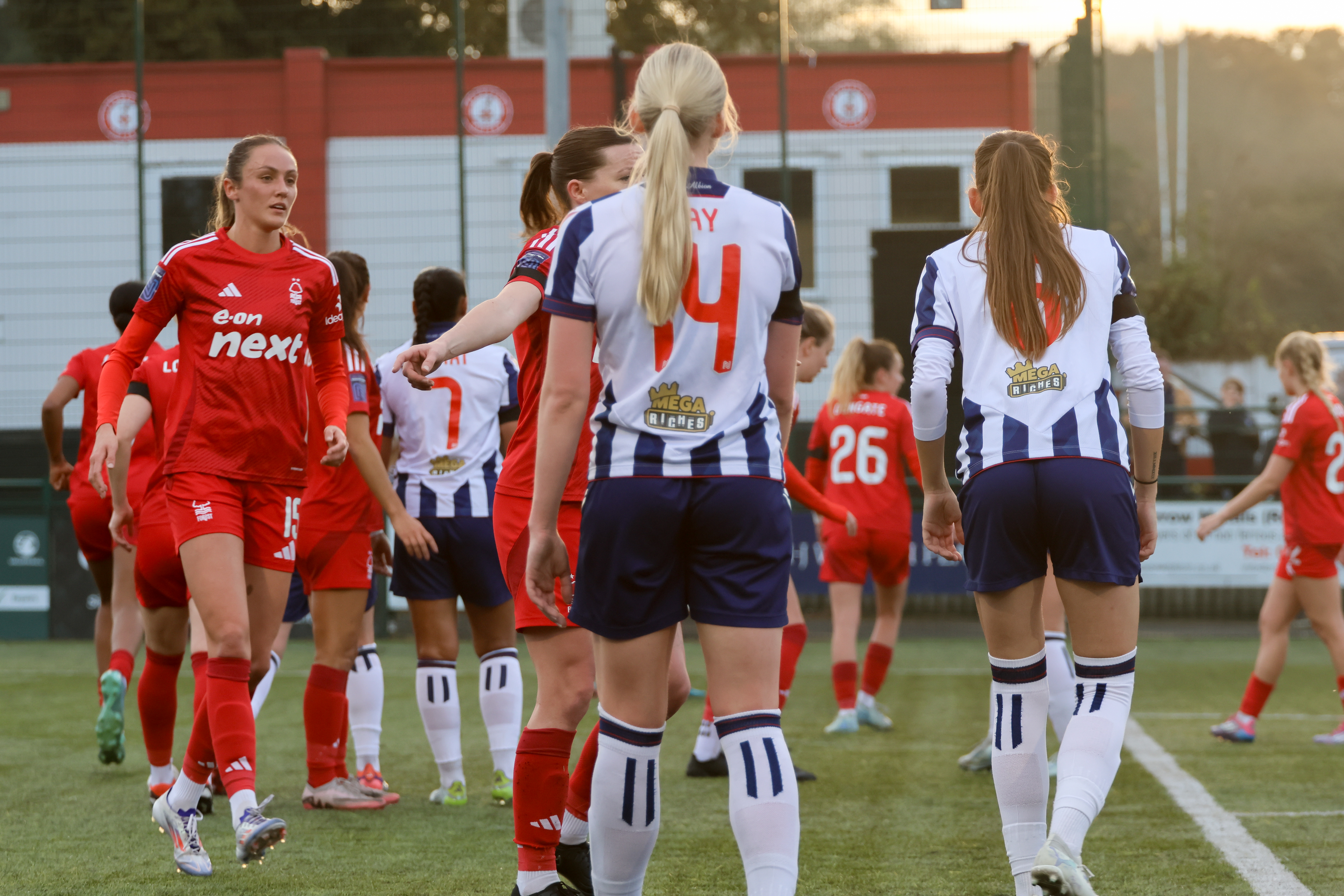 General action between Albion Women and Nottingham Forest with Albion players in home kit colours and Forest in red