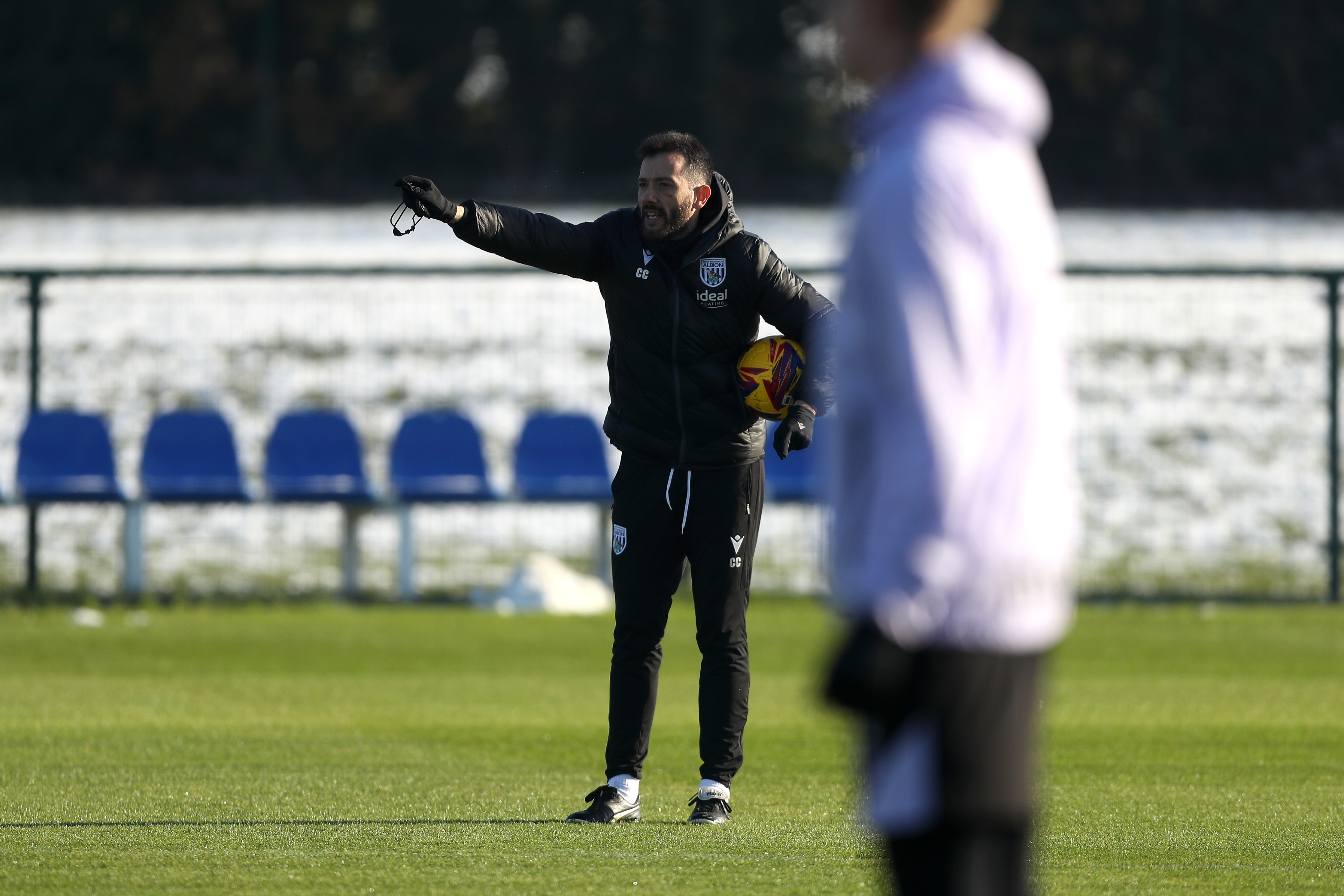 Carlos Corberán delivering instructions to his players on the training pitch 