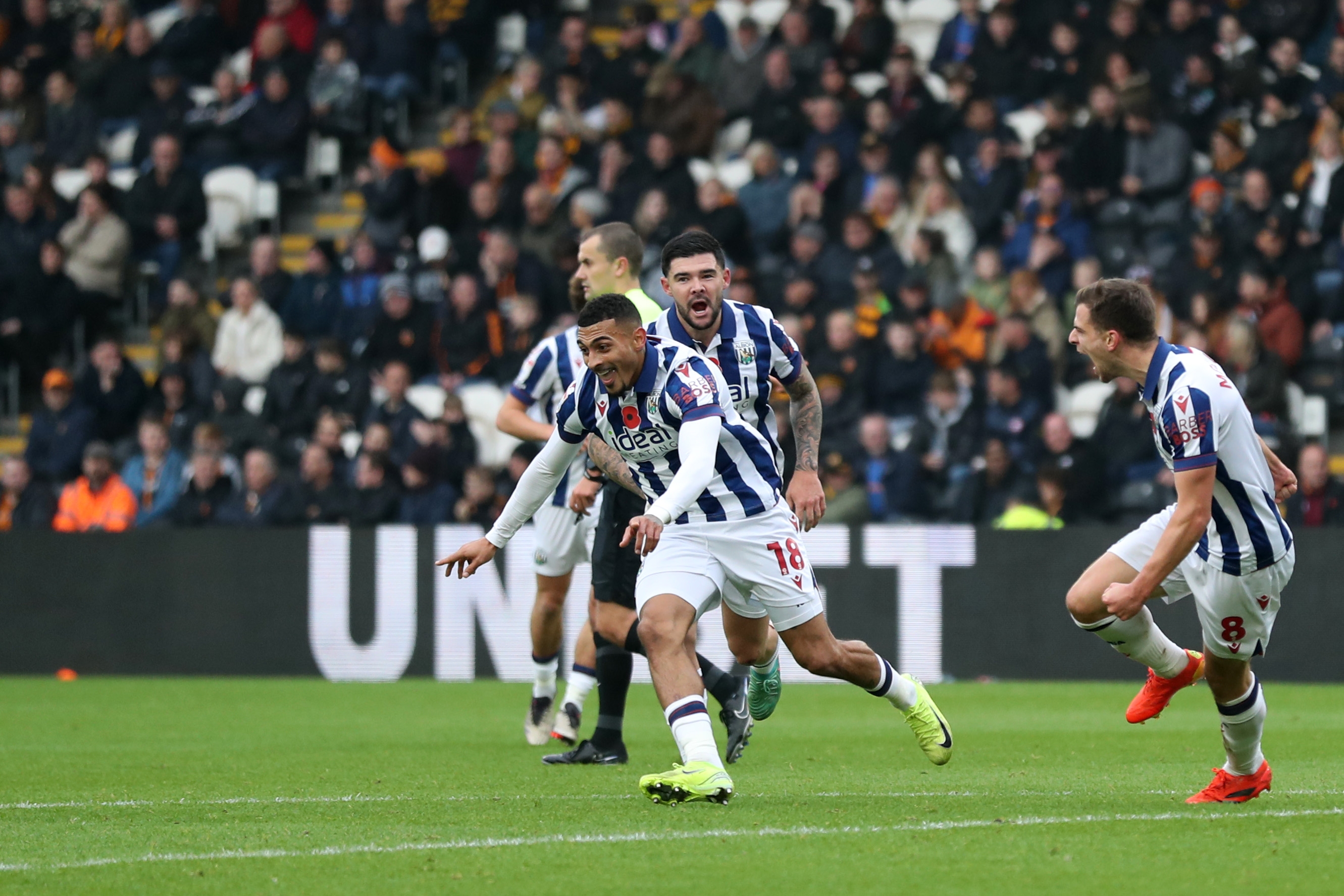 Karlan Grant celebrates scoring against Hull City with team-mates