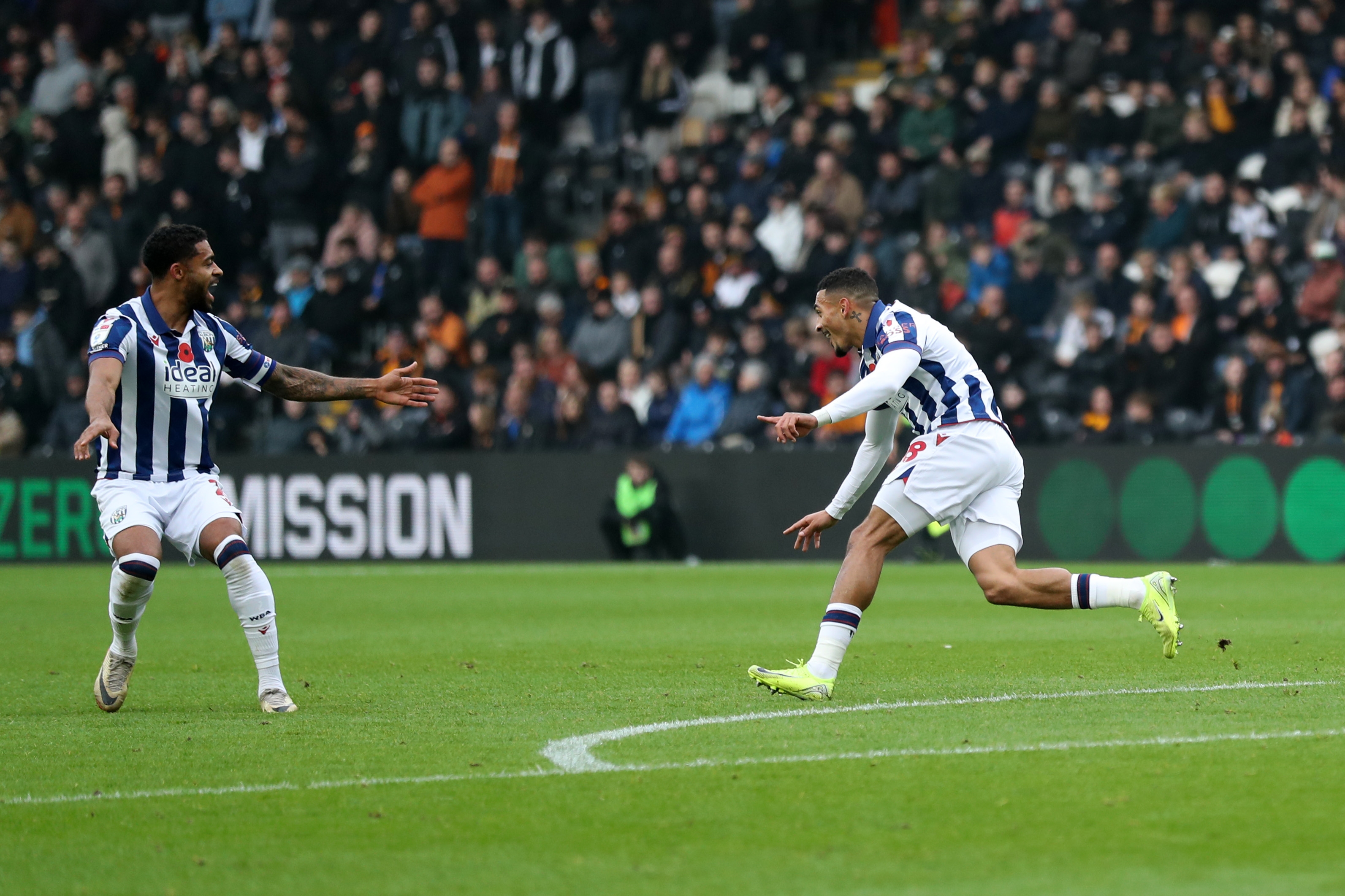 Karlan Grant celebrates scoring against Hull City 