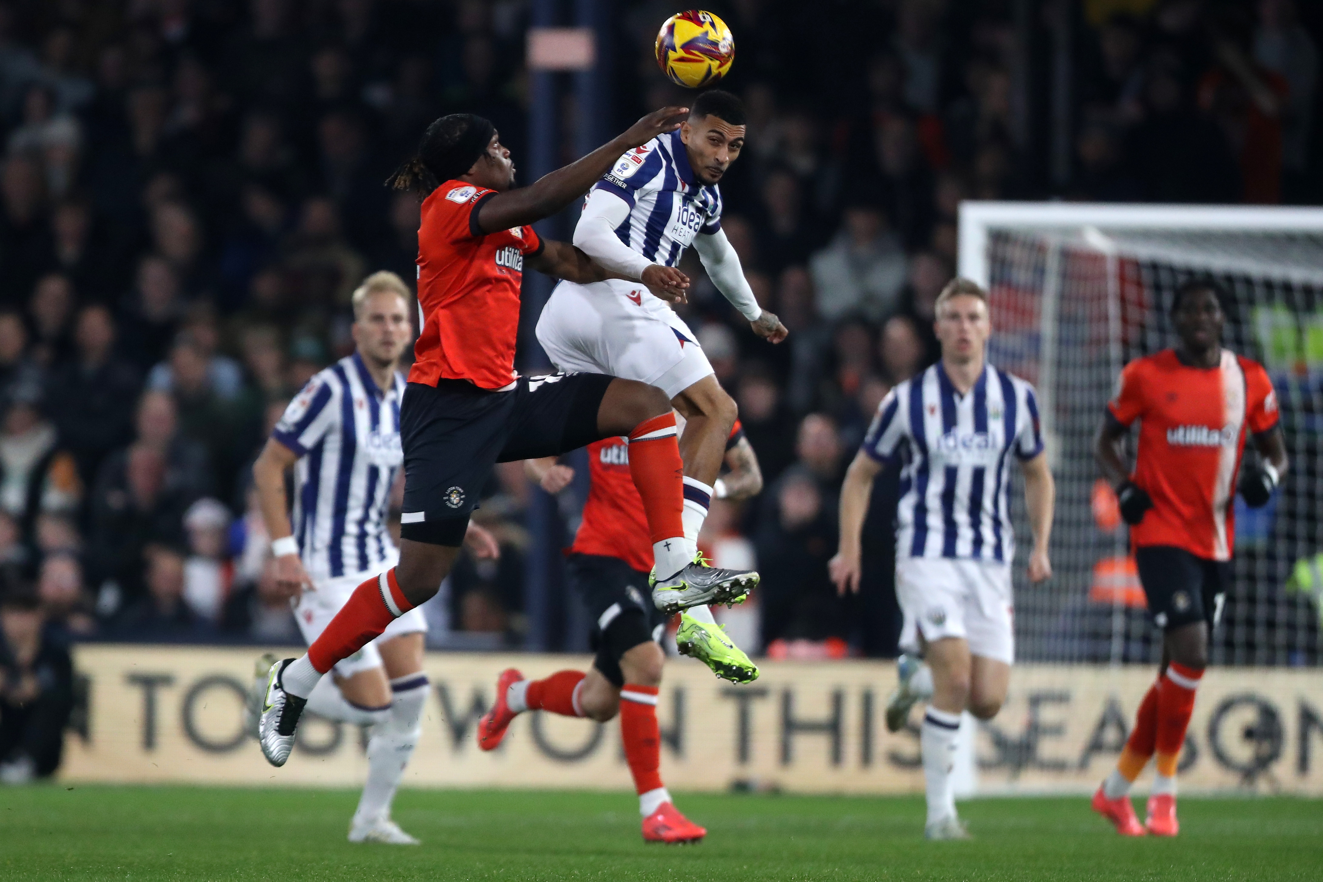 Several players jump to try and win a header at Luton 