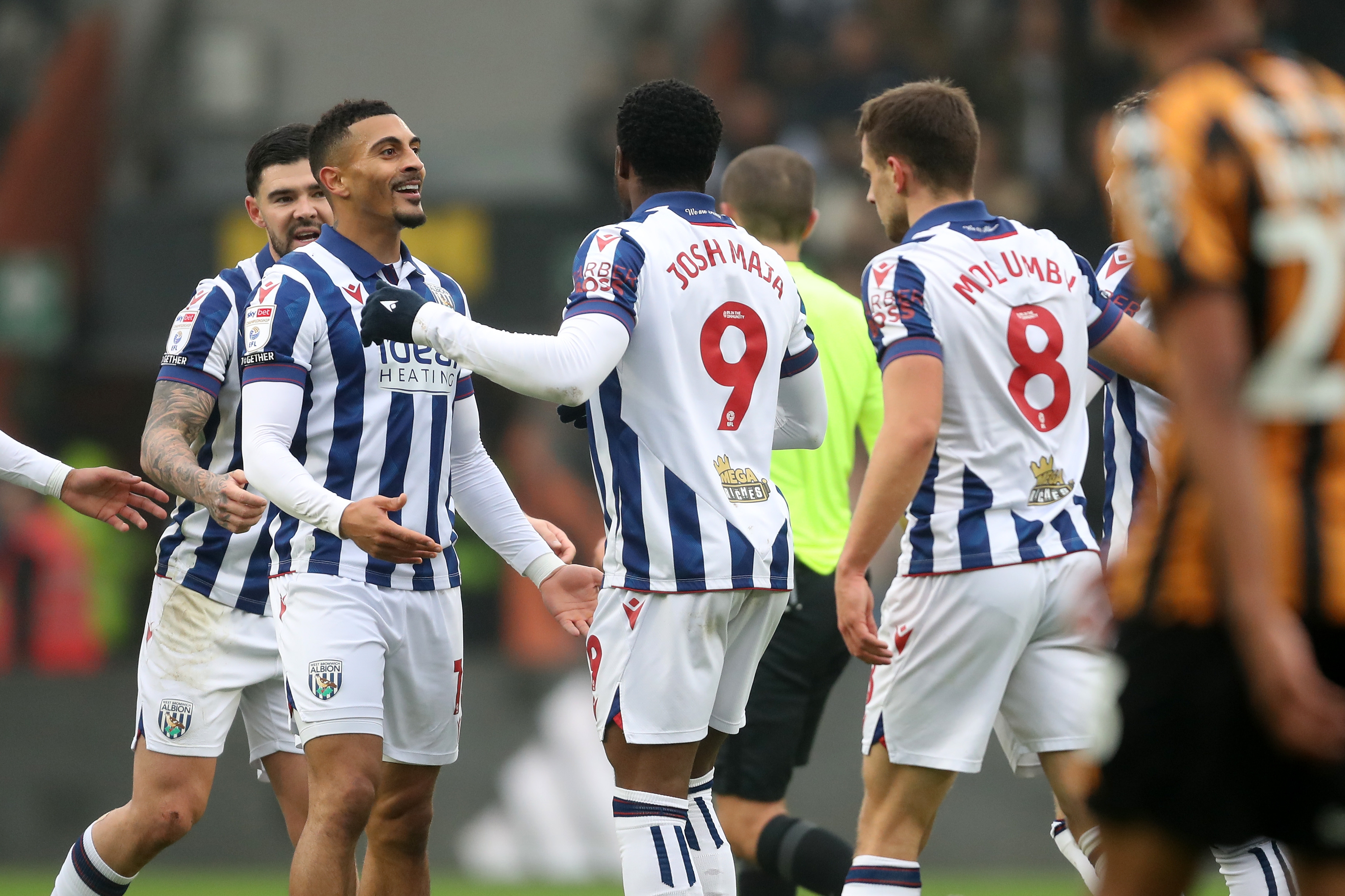 Karlan Grant celebrates scoring against Hull City with team-mates