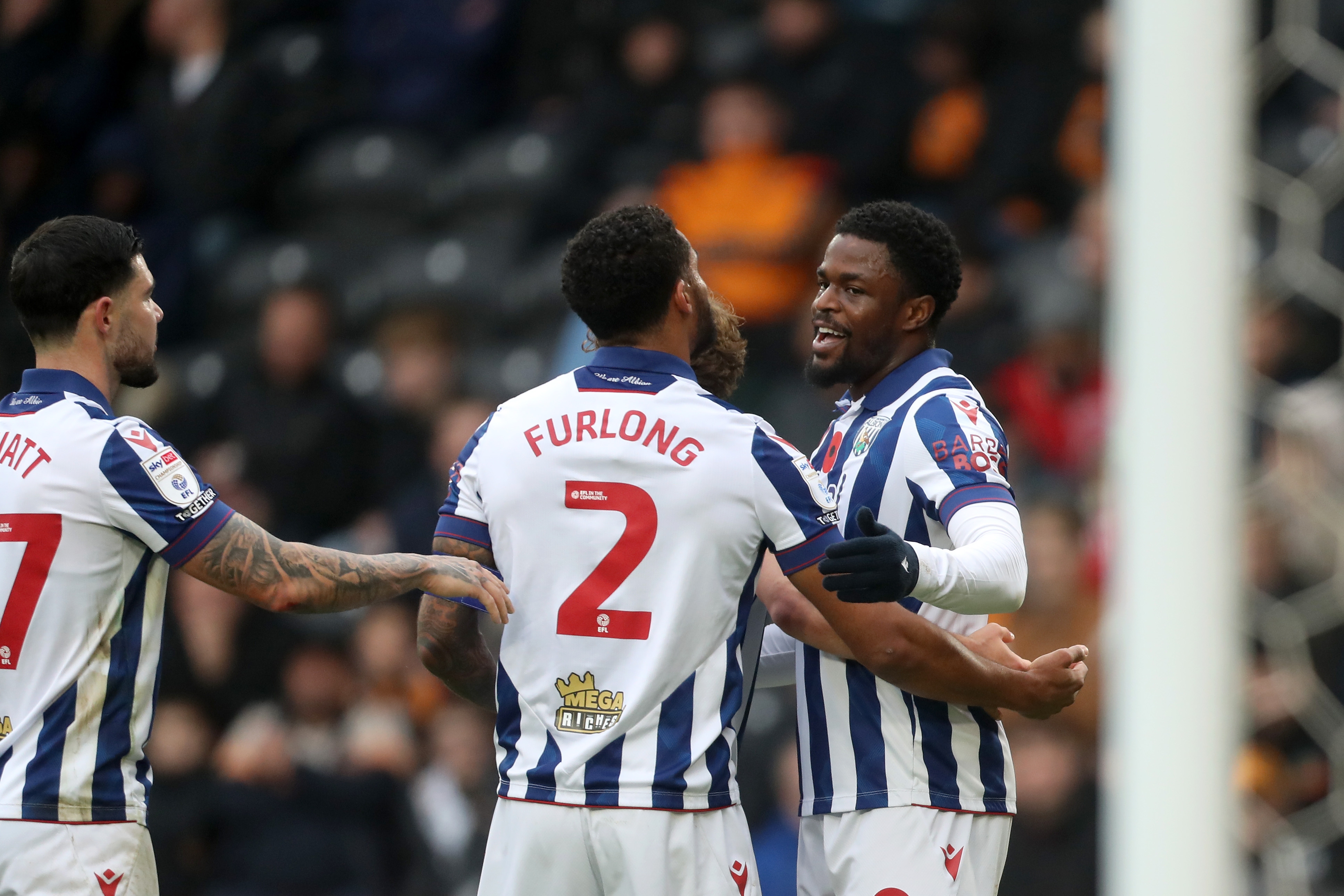 Josh Maja celebrates scoring against Hull with Darnell Furlong